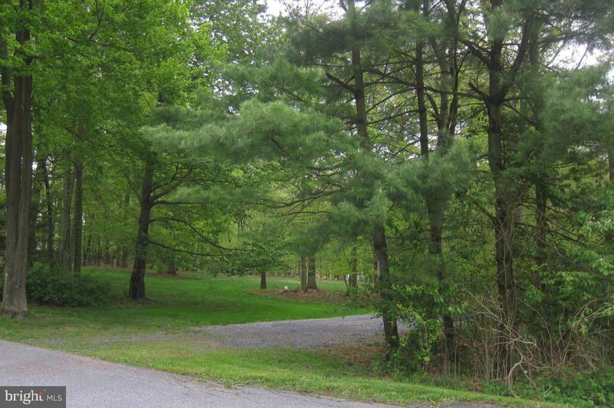 Premium wooded lot at end of cul-de-Sac. Partially cleared, private tree lined with mature trees. Close to Middle Creek Wildlife. Any builder, Perc completed and approved.