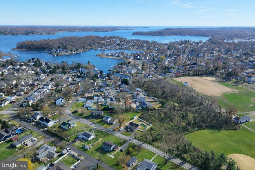 Edgewater’s South River Park Waterfront Community Living at its best. Enjoy the water centric lifestyle with community water access, boat ramp, community beach, two boat slips, fishing and crabbing piers and a community clubhouse.  Fully updated three-level home on large 1/4-acre lot (please ask about adjacent parcel) features a refreshed exterior with new Hardie board siding, front patio walkway, new roof, refinished deck with UV awning, new storage shed, mini grape & blackberry vineyard and extra patio plus parking pad offering both curb appeal and practical living space for gardening and relaxing outside.  Walking distance to Edgewater Elementary and Edgewater Park Rec Fields.
The home offers flexible living spaces across all three levels, including a finished lower recreation room with new tile floors, wet bar and fully renovated full bathroom.  Creative kitchen space with white shaker cabinetry, stainless appliances and quartz countertops. New upper cabinetry (Seller will remove if requested to create more dining space) along with movable kitchen prep island and convenient pantry complete the perfect morning ritual space. New $13,500 mini splits installed 2022 for AC and brand new owner's bath luxury renovation completed '25 with Lux Vanity Mirrors.

Life doesn't get better with a spacious yard with room to relax, entertain, or gather around the firepit after a day on the water just minutes from shopping, dining, and major commuter routes, this home delivers the perfect blend of lifestyle, comfort, and convenience. South River Park is a special benefit tax district with bylaws but NOT an HOA.  View Interactive floorplan virtual tour for additional photos and info,