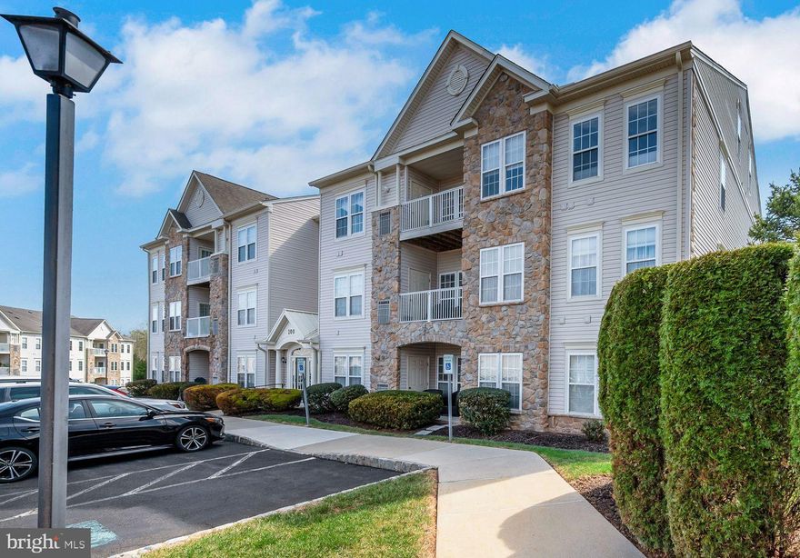 Welcome to Forest Ridge, an exclusive 55+ community where the active adult lifestyle is enhanced by modern amenities and low-maintenance living. This 3rd floor, 2-bedroom, 2-bathroom unit is enhanced by 9-foot ceilings, multiple ceiling fans, neutral paint/carpet and is truly move-in ready! A foyer entry with double closets leads to an open concept living and dining room area filled with an abundance of natural light. A centrally located kitchen features upgraded 42" cabinets, Corian countertops, a breakfast bar, large pantry & access to the convenient in-unit laundry area. All appliances are included in the sale. French doors lead to the sunroom/den/breakfast room; a delightful spot to enjoy your morning coffee while providing access to the private rear patio--overlooking community open space. Retreat to the spacious primary bedroom, featuring walk-in closets and a private ensuite bathroom with tile flooring--complete with a double vanity, linen closet and stall shower. An additional well-appointed bathroom is conveniently located just steps from the large 2nd bedroom. Don't miss the updated utilities--new HVAC installed in 2022, and new hot water heater installed in 2023.  Common area/grounds maintenance, landscaping, snow removal, and trash removal are included in the monthly association fee. The community clubhouse is a hub of activity with a meeting room and event space, fostering an active and social lifestyle for residents. Pets are welcome. Shopping, dining, nightlife and community events are just minutes away on route 611 in Warrington and in historic Doylestown Borough. Book your private showing today!