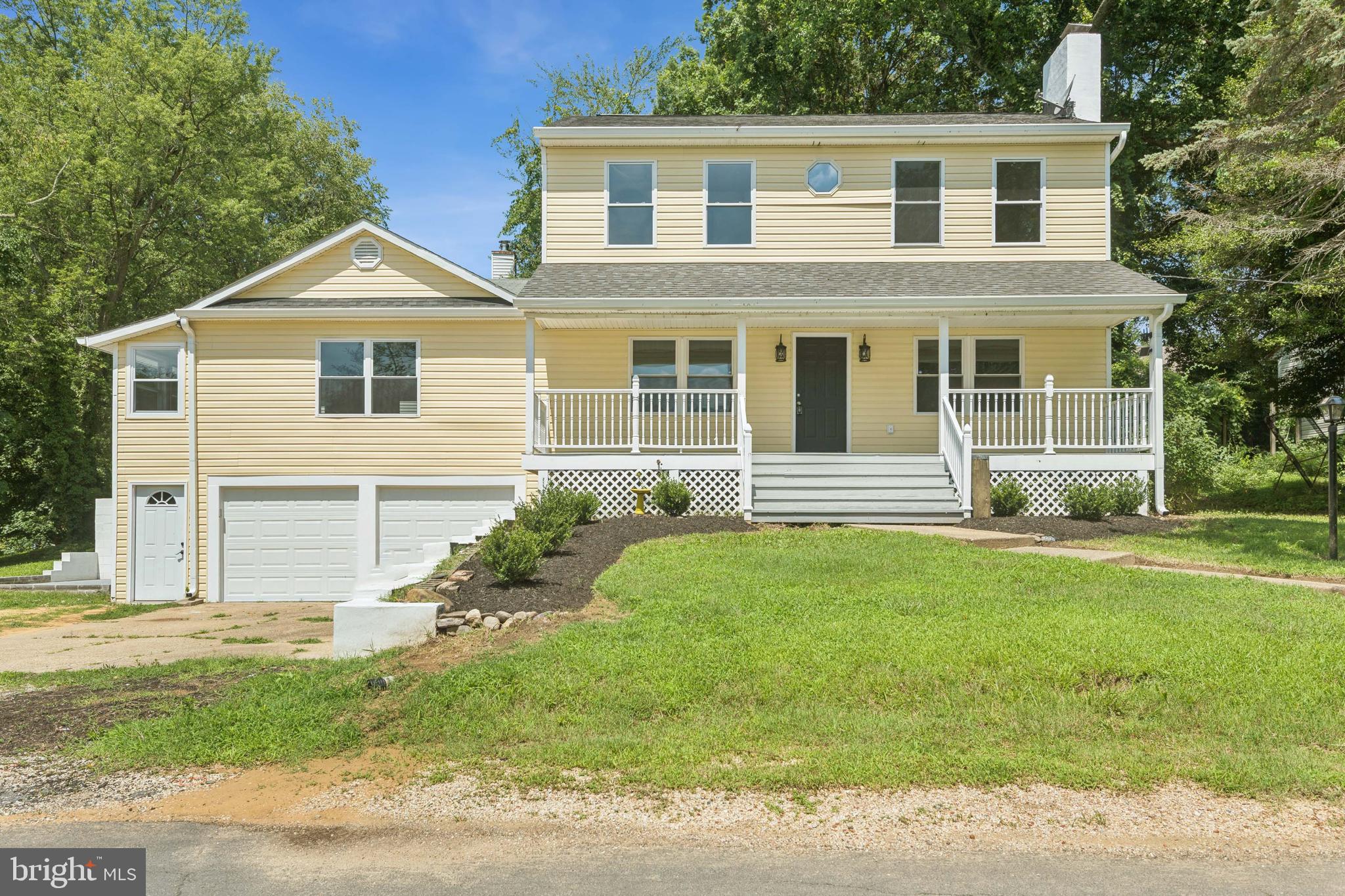 This five-bedroom, three full-bath colonial is situated on a corner lot in the desirable Cape St. Claire neighborhood of Annapolis. This home boasts a charming front porch and relaxing side patio, along with ample off-street parking including a two-car garage and four-car driveway. Step inside to find a home that is truly move-in ready, featuring fresh paint throughout, gleaming hardwood floors, new carpet, crown molding and recessed lighting. The updated kitchen showcases new cabinets and new stainless-steel appliances. The living room features a cozy wood-burning fireplace, adding warmth and character to the heart of the home. A bright and spacious great room, with sunroom area, provides a versatile space perfect for entertaining or relaxing. The main level offers flexible living options with two bedrooms featuring new carpet and an updated full hall bath. Upstairs, the primary suite is a true retreat, featuring cathedral ceilings and an upgraded en-suite bathroom with soaking tub and separate shower. Two additional bedrooms and another updated full hall bath complete the upper level. The lower level includes convenient garage access, rec room with new carpet, laundry closet with a new washer and dryer and a tiled storage room. Nestled in a charming, well-established community known for its welcoming atmosphere and excellent amenities, this move-in ready colonial offers the perfect setting for enjoying the Annapolis lifestyle.
