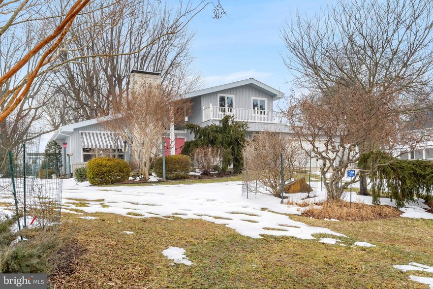 Custom-built 4BR/2BA Contemporary, 1.5-car garagewith work bench area, resting on a beautifully landscaped ½-acre lot with views of the Elk River. Bay-Wise Certified Native Landscaping includes deer-protected areas and a fenced vegetable gardens. Fireplace with wood stove/insert. Major updates include new roof and skylight (2025), refreshed upper Trex deck (2023), LeafFilter gutters with transferable lifetime warranty (2020), kitchen remodel (2018), and fully renovated primary bath with walk-in shower (2013). Full semi-finished basement.  Enjoy community water access, beach, boat launch, fishing pier, and recreation area. Move-in ready with thoughtful upgrades throughout. A 'Must Tour'. Schedule your tour today!!