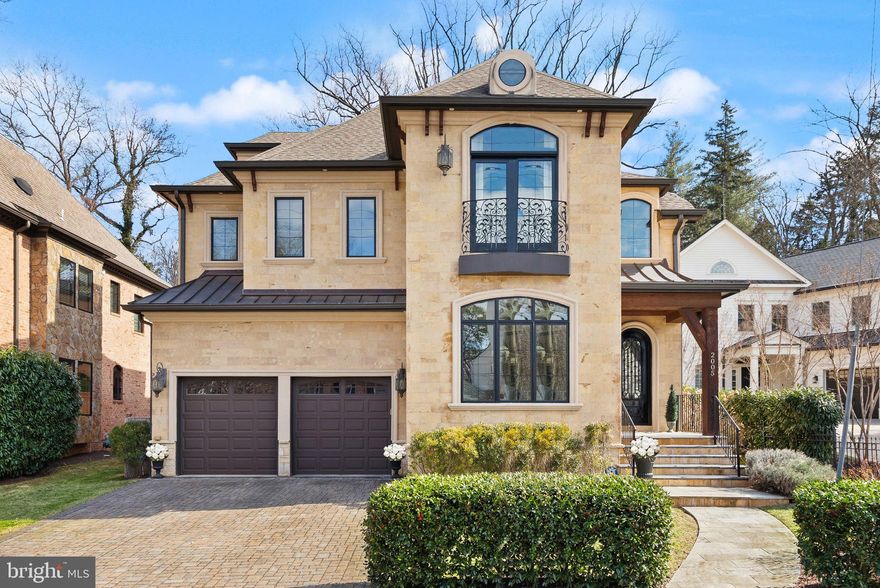 Step into refined luxury with this expansive, 7,500+ sq‑ft, four‑story residence nestled in the heart of Palisades/Berkley. Flooded with light, every corner of this home exudes quality—from its gleaming wide-plank wood floors and custom stone and metal accents to its state‑of‑the‑art appliances.

A grand foyer welcomes you into an elegant first floor featuring a refined living room, a formal dining room, and home office. The gourmet kitchen, with soaring barrel‑vaulted brick ceiling, is a chef’s delight, outfitted with premium Wolf and Thermador appliances and a generous breakfast bar. French doors in the adjacent family room open to a private outdoor area perfect for al fresco dining and relaxation. Convenience abounds with an elevator to all floors, two‑car garage and mudroom on the main level.

The second floor boasts a luxurious owner’s suite complete with a private balcony, dual walk‑in closets, and a spa‑like bathroom featuring heated floors, a soaking tub, and a separate shower, alongside three additional bedrooms with two additional full baths and a large laundry room.

The versatile third level offers an additional bedroom and bathroom, while the lower level is an entertainer’s dream. The spacious lower-level recreation room complete with gas fireplace and a secondary bar and kitchen has a separate entrance, plentiful storage, and bedroom and bathroom. Outside, enjoy an expansive private, custom flagstone patio perfect for entertaining. Just steps from local shops, cafes, a farmer’s market, park, and easy access to Georgetown and major transport links, this property perfectly marries urban convenience with timeless sophistication.