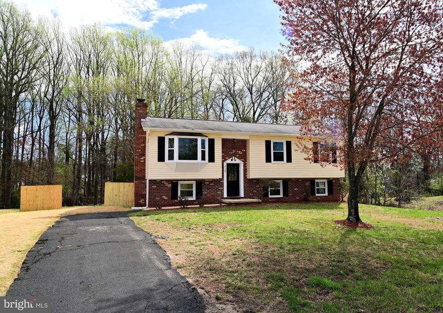 Charming and completely remodeled Home with Modern Comforts! 
Welcome this charming Five (5) bedroom, 3 full bathroom, Two(2) kitchen home located in Waldorf, MD. This beautiful home is nestled in the 1/2 acre land with wooded area in the back in the sought after St. Charles community. This home features a modern open floorplan and generous sized rooms. The first floor boasts a large family room with a bay window, 3 bedroom, 2 full bathroom,  dining room and an open kitchen with a breakfast bar walk to the deck. The lower level has a large living room alongwith fire place with sliding door to the patio,  2 bedroom, a full bathroom, kitchen, washer and dryer with a seperate entrance door . Enjoy the spacious bright private lot, perfect for gatherings or quiet evenings in the deck and patio. Newer HVAC, Windows and washer and dryer.