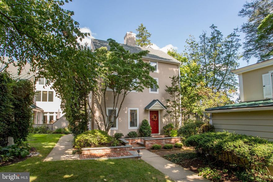 Ideally located in the heart of historic Doylestown Borough this luxurious detached single family condominium in Barnes Court boasts refined levels of elegant living, charming outdoor spaces and unexpected privacy. A picturesque setting, graceful gardens and inviting brick walkway lead to this artfully updated and pristine home. From the luxurious finishes and tasteful window treatments to the shimmering light fixtures, no detail has been overlooked. The decorative color palette and neutral wood flooring are on-trend and seamless throughout the home. Abundant light fills the living room through a picture window framing the pond and courtyard beyond. Crown molding, wide baseboards, and electric fireplace flanked by custom built-ins, create a cozy comforting space. French doors open to a brick patio perfect for lounging and soaking up the afternoon sun. The delightful eat-in kitchen was thoughtfully designed with abundant storage, quartz countertops, Thermador appliances, and heated tile floor. The breakfast nook is tucked away next to glass doors that open onto a private maintenance-free deck with Walpole fencing. An inviting gas fire pit, soothing fountain, decorative trellis and tiles, create a warm space for conversation. Double glass doors offer easy flow into the formal dining room. The remodeled staircase with stone accent wall leads past bright casement windows to the second level. The graceful primary bedroom with crown molding, picture window and “fandelier” opens into the spa-inspired en suite bathroom with faux painted walls, dual vanity, tile and glass stall shower and heated floor. Across the hall is a walk-in closet and a lovely guest room with en suite bathroom. Head up to the third floor to find a third bedroom or home office with vaulted ceiling, bright windows and large custom built-in dresser and storage cabinet. A laundry room and full bathroom with quartz vanity, and a large tile and glass shower, complete this level. The finished lower level is home to the gorgeous family room with walls of built-in shelves and custom cabinet with widescreen TV, a wet bar, spare full-size refrigerator, and clean dry storage. Enjoy maintenance free living in this turn-key condo and spend your weekends exploring the myriad of restaurants, museums, and galleries that are just steps away from your front door.