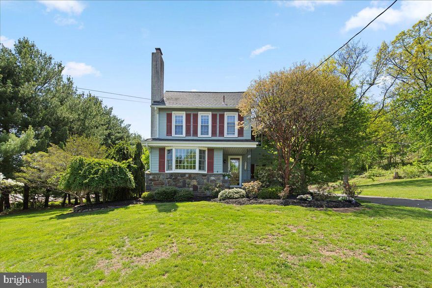 Step into a piece of history with this enchanting home nestled in the heart of Perkasie borough on a generous and private 1.5 acres.  If you're looking for that unique blend of class and country charm, this is it! Originally built in 1895 and renovated with modern amenities including a dream kitchen, this 3 bedroom, 2.5 bath has maintained all its old-world character. 

Heading inside, you'll be welcomed by a gorgeous wood burning fireplace and charming bay window, bringing in lots of natural light. An open dining room with sunlit window nook leads into the stylish eat-in kitchen, which features an abundance of wooden cabinets (REAL wood), granite countertops, stainless-steel appliances, a large gas range, and the custom-made center island provides additional storage and seating. Sliding glass doors off the kitchen lead you onto your impressive stone terrace with another built-in fireplace, ideal for entertaining or just a cozy night under the stars! The elegant stone walkway from the terrace brings you around back to your beautiful, covered porch - another peaceful place to relax after a long day! The hallway off the kitchen features a sunny laundry room (with a laundry shoot!), a spacious mudroom and a half-bath. Upstairs, there are three bedrooms with all-day natural light, one even has a private covered balcony! There are two full baths, one with a jacuzzi tub, skylight and carpeted sitting room with granite-topped vanity and plenty of cabinets for linens and towels. There is an attic full of natural light that provides plenty of additional storage space, and an unfinished but dry basement for more storage overflow, which includes a huge freezer. 

Heading to the outer structures, you'll see an oversized 2-car garage (with attic space above for even more storage), as well as an attached carport to cover a third vehicle. Behind the garage is an attached bonus space - a large, finished room with lights, speakers, windows, central air, and private entrance door.  This is perfect for an at-home business or could be turned into an in-law suite. As if all this wasn't enough, there's also an oversized detached matching shed! Large and with windows, it's roomy enough to cover a 4th vehicle and still have ample space for more storage items. Both structures match the siding and style of the house, adding to the overall sophistication of the entire property.  With 4 covered parking options, the wide and paved driveway offering lots of other parking spaces, and plenty of off-street parking in front as well, your friends and family will have no problems when visiting! 

With its serene setting and wildlife, this expansive and well-manicured property is a nature lovers dream. Additional privacy is provided by 10 large evergreen trees planted 2 years ago, adding to the all-year beauty and peacefulness. You would never guess this quiet country setting is within walking distance to Perkasie's historic town-center with quaint shops, cafes, ice cream shop, farmers market, pubs, arts festival, and home to America’s oldest Christmas tree lighting! Just a 5-min drive will bring you to the Perk, Sellersville Theater, Washington House, and rt 309. A 15-minute drive will get you to Nockamixon State Park and Peace Valley Park!

The home's historical charm is further highlighted by Belgium block stones once used in Perkasie's early roadways. Obtained by the previous owner, these original stones (once part of the thousands used to make up the roadways before the days of asphalt) were incorporated into both fireplaces and the stone facing on the front of the house, as well as the terrace walls - this house truly carries parts of Perkasie's history! Don't miss your opportunity to see this gem of a home that not only offers a unique glimpse into Perkasie's storied past, but also a delightful escape into nature, all while being conveniently close to the benefits of town!