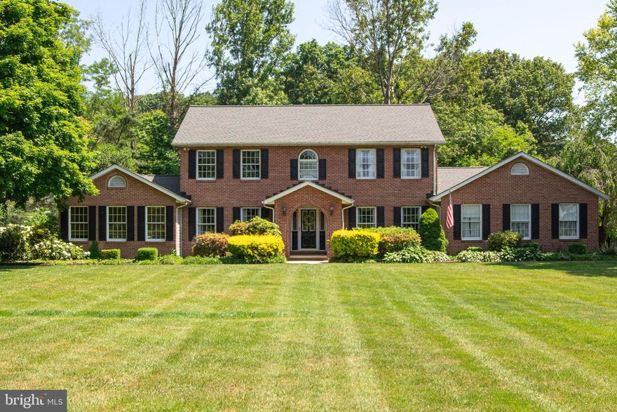 Curb appeal abounds with this stately 3500+sq..ft, four/five bedroom colonial embraced by gently rolling fields and farm land.  A strong but gentle ambience grabs you as you enter the center isle home as you welcome one and all into your formal living room thru the French doors.  Stroll thru to the country kitchen/dining area with all the amenities needed for a large gathering or a simple dinner. If you care for a more formal affair retreat to the large formal dining room just thru the nine light door from the kitchen area.  Also adjacent to the kitchen  is the first floor family room with large brick  fireplace, mantel and stylish wood stove to warm your heart in so many ways.  Sliders to rear yard, deck and in-ground pool.  Four large bedrooms on the upper level with master bath and walk in closet. First floor laundry and powder room for your convenience. Wood floors are from 100 year old oak.  
Not to be left out but this home also offers a in-law suite with separate entrance, bedroom, bath and living room area.
One car garage plus a two car oversized detached  garage with lots of storage on the 2nd floor. All of this plus full basement with workshop and much more  ready for you to make your own.
Roof is less than five years old- 30 year shingle
Pool pumped replace in 2022'
One Heat pump less than five year old 
Two-zone heat
Home total bedrooms arel five bedrooms and three and half baths counting the in-law suite. 
sq.ft. is estimated