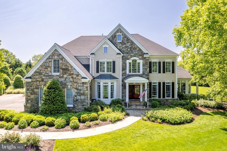 This stunning 4-bedroom, 4.5-bathroom home in Davidsonville’s highly sought-after
Woodhaven neighborhood is nothing short of impeccable. Serenely surrounded by trees
and farmland,  with the convenience of quick access to Rt. 50, this home sits on an
over 1-acre lot and includes an in-ground pool, lush landscaping, and over 7,000 sq ft of
exquisitely finished living space, loaded with upgrades. This home boasts polished
elegance, superior craftsmanship, sophisticated detail, and design-inspired features in
every room! Hardwood floors, custom moldings, soaring ceilings, and lofty windows
enhance the common areas. The first floor features an office/study, large private dining
room, and a gourmet custom kitchen with a Wolf 60” Dual Fuel 6 burner range with pot
filler and Sub-Zero appliances throughout, including fridge, ice maker, and
beverage/freezer drawers. Entertaining is made seamless with an oversized island, eat-
in casual dining space, a dedicated pantry with freezer, and a butler's pantry with
beverage center. An impressive two-story family room, formal living room, sunroom,
additional staircase, mudroom/drop area, and half bath complete the main level. The
upper level offers a spacious primary suite with two walk-in closets, 2 large bedrooms
with a Jack and Jill bath, a 4th bedroom with an ensuite bathroom, plus the convenience
of 2nd floor laundry.

Travel downstairs and the basement could serve as a fabulous in-law/au pair suite with
a kitchen (with fridge, microwave and dishwasher drawer), a full bath, dedicated laundry
for the basement floor, family room, and large bedroom with a walk-in closet (not a
bedroom for tax purposes). The basement also includes a craft room and a music room.
The showstopper of this basement is a stunning custom home movie theater that seats
nine with projector, professional movie screen, and massive reclining leather movie
chairs! The exterior is a complete outside oasis and will satisfy all your entertaining
desires with an expansive stone patio off the family room and outdoor kitchen with built-
in gas barbeque and fridge. The exterior features extensive hardscaping, and
landscaping surrounding the beautiful pool, exterior low voltage lighting, a newly painted
pergola (perfect for a MD crab feast!), exterior irrigation, a fully fenced backyard, and a
whole house generator. All in all, this home is truly a must-see for anyone who
appreciates luxury living at its best!