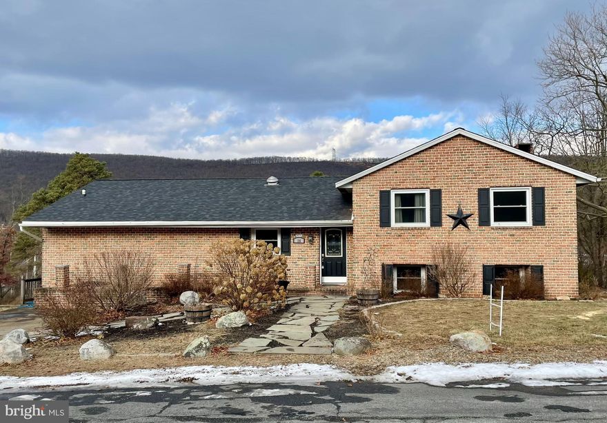New Roof and New Price!!  Motivated Seller!! Nicely maintained and updated brick split level available now in the Cresswell Gardens / North Schuylkill School neighborhood.  This home is much larger than it looks, offering 4 levels of living space to spread out.  Step in the front door on the main level and to the left, you will find a nice-sized kitchen with plenty of cabinets including a generous pantry cabinet.  An open concept dining room and living room offers a place to dine and entertain.  A new slider door was recently installed and the space is ready for you to add your new deck.  Just off the kitchen is a large recreation room complete with a pool table and bar.  Up one level you will find 3 bedrooms and a full bath.  Down one level is a large primary bedroom with ensuite bath and a wood burning fireplace.  The lower level is finished with newer carpet and offers a great place to relax with family and friends.  Outside offers a large yard which stretches back to Pine St, as well as a rear entry garage for storage.  The new roof was installed. The gutters and downspouts will be installed prior to settlement.  Other updates include all new windows and central air in 2018 and a new well pump in 2022.