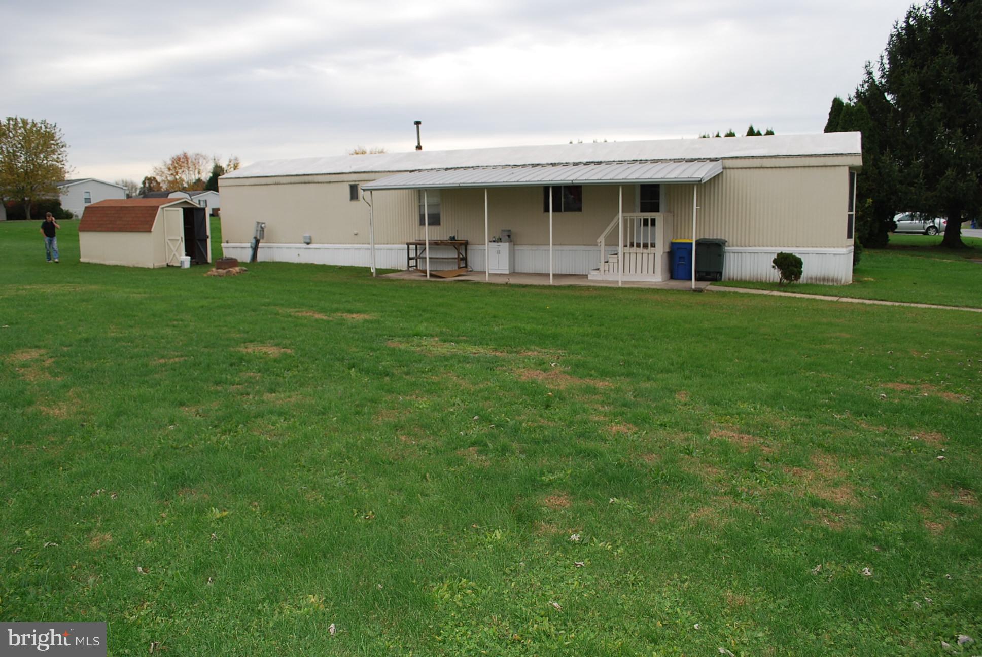 Affordable two bedroom home at Tall Oaks. Nicely set on a corner lot, conveniently located. Seller sacrificing for personal reasons. This home is efficiently total gas (natural gas) including dryer and hot water tank. Bright front kitchen with breakfast bar and island. Lot rent is $390/mo.