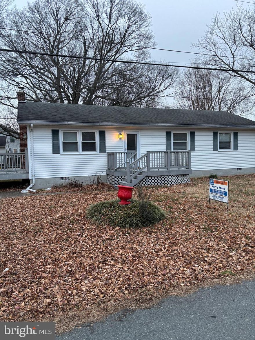 Lovely well maintained rancher -- freshly painted and new carpet installed.   Home has three nice size bedrooms and one full bath and a half bath.  This is perfect for first time homebuyers.  There is woodstove to keep you warm during those cold days, and heat pump, and baseboard heat. The water treatment system is owned. Home is located on a large corner lot with a front porch and back deck for entertaining, storage shed and there is room for future garage.  Also,  a front porch and back deck for entertaining, is only a block from the Chesapeake Bay. The community has water privileges, community beach, playground, piers and boat ramp.
Please remove shoes when showing the carpet is brand new.