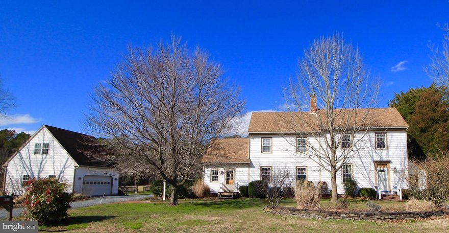 NOW ACTIVE!! Come see this charming, lovingly maintained Federal and Greek Revival style 3BR  2BA 2,562 sq ft home situated on a picturesque 5 acre country setting in Hebron.  MARDELA / WESTSIDE SCHOOLS!!  Separate garage offers and additional 576 sq ft finished studio above.   Sitting just outside the Historic Village of Quantico, the  Chelsea  c. 1840, is a featured home in  At The Crossroads - An Architectural History of Wicomico County  by Paul Baker Touart.   Relish in the character of centuries past while enjoying the peace of mind that all the major updates have already been done to preserve this historic home and keep it efficient by today s standards.  Enjoy the truly rustic real wood floors throughout this home, impossible to duplicate today, along with gorgeous mill work and mantles common for this era.  Cozy kitchen features Butchers Block countertops, hardwood floors, electric stove and newer dishwasher, plenty of storage in the  walk in pantry, 2nd storage closet, and a sunlit breakfast nook.  A formal dining room  just off the kitchen invites you to real sit down meals with the ambiance of a wood burning fireplace.  The  formal living room area, adjacent to the dining room, provides ample space for gathering and also begs you to stay a while by the warmth of the pellet stove.  You  ll want to spend all day taking in the gorgeous and serene views of the rear acreage from the beautiful family room addition that was constructed in 2008 which features a second pellet stove, bamboo flooring and tall ceilings.  To enhance modern convenience, a new large mud room / laundry room was added with skylight.  The original section of the home which you enter from the formal Living room, showcases the historic front entry and parlor space, with the main stairs to the second floor, and includes a half bathroom.    Upstairs you find the owners suite featuring 2 original built in closets with drawers in between and an adjacent full  bathroom redone in 2016 with dual sinks, and farmhouse style walls.   Second bedroom is well sized, currently used as an office, and features a unique 2nd rear staircase to the dining room below.  Step down from the 2nd BR into the cozy 3rd BR, with adorable windows, a dormer view of the back yard and extra storage areas.  A 2nd Full Bathroom was added in 2008 with a corner shower and services both the 2nd the 3rd bedrooms.   Lastly, the upstairs offers an office/nursery or small bedroom (not included in 3 BR count) and a walk up floored attic.   An unusal but charming feature of the uptairs is the rear hallway connecting all rooms with windows all the way across letting beautiful natural light throughout!  A 2 car detached garage was built in 2004 and includes a spacious finished second floor studio with laminate wood floors, gas heat, window a/c and unbelievable view from the elevated studio.   Standalone freezer in garage also included.  Adorable hand crafted garden shed, was built by the owner from materials salvaged from an old shed on site, and a corn crib still stands.  Owners plant fields of flowers to support their bee hive and honey hobby and enjoy the orchard trees which bear bountiful pears, apples, peaches and pau pau fruits.   Endless options on this land for gardening, small scale farming/crops, and enjoying the nature and wild life surrounding you! A picket fence outlines a  back yard  space perfect for pets or kids. Escape the world in this perfect hideaway.  New 30 year roof was installed in 2015, New Propane Furnace 2017 and Central Air 1st floor, New Heat Pump upstairs approx 2005 (also has baseboard backup), New Septic (2003) and was just  Pre-inspected, new Rinnai tankless water 2008, Windows throughout the house were replaced by previous owner, Mechanical room features updated 200 Amp electric, New well pump and pressure tank 2015, Culligan water system.  VERY IMPORTANT - THIS HOME DOES HAVE CABLE INTERNET!!