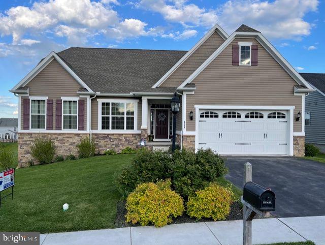 Welcome to this AMAZING, show home.....  This Craftsman style Ranch features a modern open floor plan with many upgrades that will meet and exceed your needs.   This home is a wonderful compliment for those who enjoy one floor living but want the flexibility of a great room on the second floor and a large finished space in the basement.  Solid hardwood floors, custom 4 foot wide oak staircase, granite counter top, gas fireplace, tray ceilings... the list goes on and on.  The owners suite features vaulted tray ceiling and a private bath with double sinks, soaking tub, stand up shower and a large walk in closet.  Home is also equipped with a Ranai tankless water heater with never ending HOT water for 70 straight hours.  Great memories and entertainment can be had in the lower level spacious shop that is wired 110 & 220.  Underneath the back deck features a unique enclosed storage area with barn type doors for all of your yard equipment. You won't want to miss the opportunity of becoming the next proud homeowner of this gorgeous home!