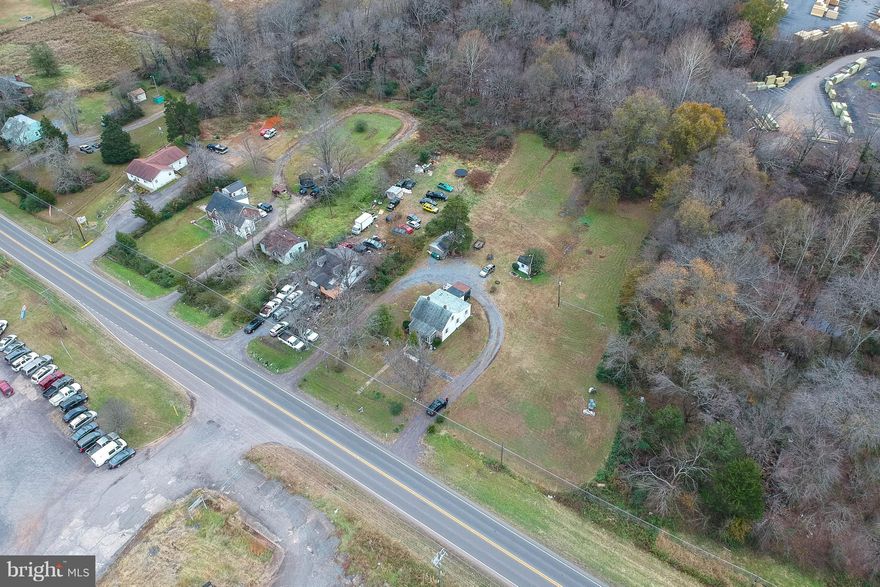 Price Improved!  The value is  in the land, zoned High Industrial. This property is a good size and has good road frontage. It is located in a transitioning area where value is rising.  Great visibility and high traffic volume. Close proximity to car dealerships, offices, and shopping centers. Can be transitioned to a mini storage, repair shop, office, warehouse, tire shop,  etc.    Water/well is in remediation process at this time.  An option of hooking up to town water may be available at buyers expense.