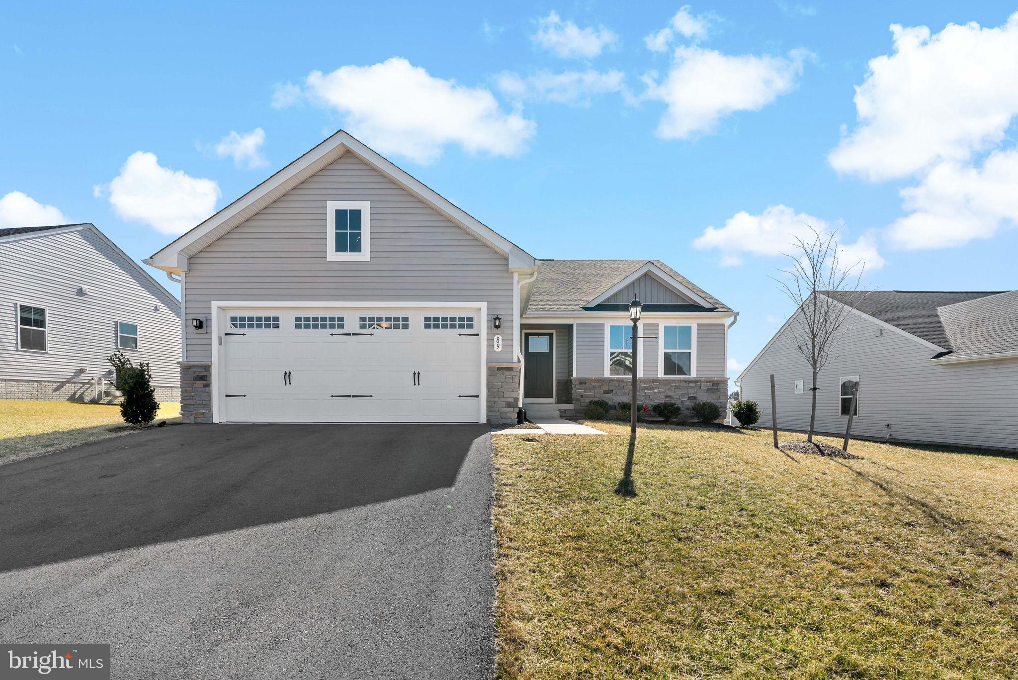 Looking for one-level living? Check out this like new and move-in ready rancher just built in 2022! The open concept provides ample space to relax and entertain while enjoying every moment. You can kick back and relax in the spacious living room, enjoy your morning coffee at the kitchen island, or gather for a meal in the dining area. The bedrooms are spacious, including the primary bedroom with an oversized walk-in closet. Enjoy the privacy of your backyard with no homes to look at behind you. The back access off the kitchen/dining area makes this the perfect setup for your patio or grill pad. The full, unfinished basement is ready for your vision and can double the square footage! The beautiful and well maintained community of Arcadia North gives you some seclusion from the hustle and bustle, yet it's close to places you need to go. Located on the outskirts of Martinsburg and next to Kearneysville near Route 9, this is a prime location with quick access to I-81 or Route 340 for easy commutes to Maryland and Virginia.