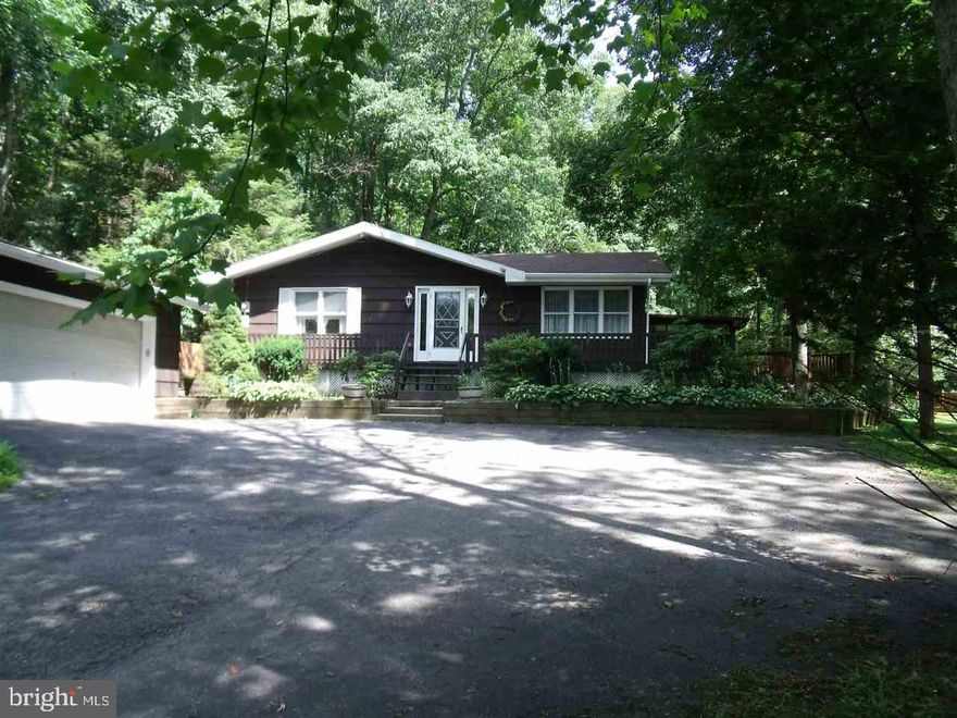 Country paradise.  Beautiful, secluded homesite on 13 acres in Clean & Green.  Enjoy deer & turkey at your back door.  Tranquil pond.  Walking trails thru the woods.  Private, yet only 10 min to the mall.  Home needs some updating, but you can't find another setting like this!