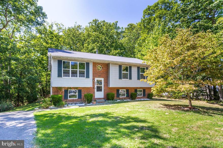 HUGE PRICE IMPROVEMENT of $15,000!  WOW!  What a Great Place to Call Home!  516 Cody Trail Is Ready For a New Owner and at This Price, It Won't Be Hard to Find One!  Just Blocks From Lake Lariat and 1 Mile From the Patuxent River, This 4 Bed, 3 Full Bath Home Is Just Right! Well Situated on an Open Corner Lot and Minutes From Everything, There Are Memories to Be Made, Right Here!  The Dark Bamboo Floors Throughout Gives the Home a Bold, Warm Feel!  With Both Upstairs and Downstairs Rooms for Getting Together, There is Also a Large Rear Deck to Enjoy the Evening Sunsets and Nature.  Cathedral Ceilings Give Each Space the Open Feel as You Easily Move From One Room to Another. The Chesapeake Ranch Estates Is Well Know For It's Abundant Amenities, Like 2 Private Community Beaches, a Private Lake with a Kayak Launch, Full Campground Facilities, the Private Airstrip Surrounded by Hangars, Bike Lanes, Roving Security and More!  Commuter Lot Close By for Quick Travel Into DC and Annapolis and a Short Drive to PAX River NAS and Andrews AFB.  Reach Out to Make Your Appointment Today!