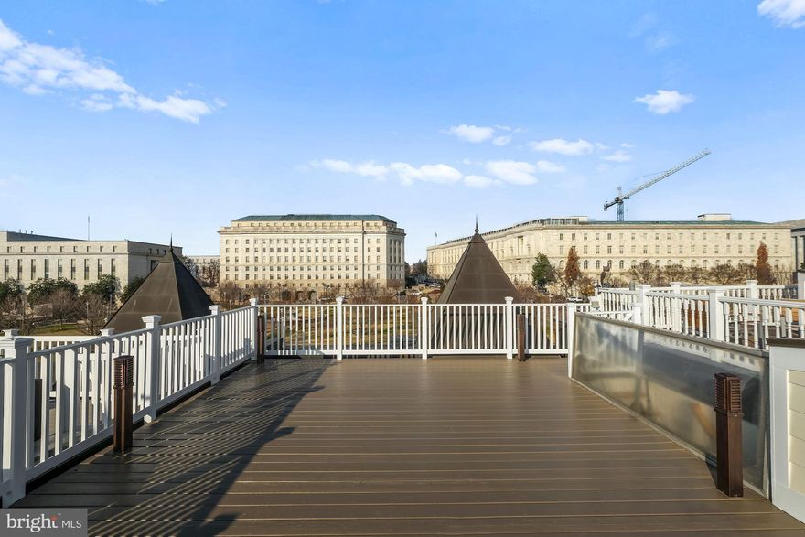 Location, location, location!  With one of the best roof decks (approx 500 sq ft)in all of Capitol Hill, this penthouse condo has phenomenal views of the Capitol Dome & the Washington Monument, and is sited directly across from the House Office Buildings of Rayburn, Longworth and Cannon.  The fabulous roof deck offers grand entertaining space and 360 degree views of DC.  Newly built in 2013, the unit features nearly 1500 square feet of finely rendered interior space, plus 3 additional balconies.  The light-filled spacious living room has a gas fireplace + dining space. The upscale, gourmet kitchen boasts SS Viking appliances, granite counters & gas stove. There is also a powder room on the main level.  The upper level offers a master suite with sweeping views & ensuite BA, as well as a large 2nd BR & full ensuite BA. This is a rare opportunity to own a property so close to the House of Representatives, the Senate and the Capitol!
