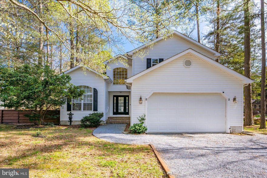 Welcome to 2 Moonraker Rd, a bright, airy, and beautiful contemporary home in Ocean Pines with many recent upgrades, including a new HVAC system in 2026. Step inside to find a soaring two-story foyer and flowing LVP floors, just installed at the beginning of 2026. The two-story ceilings continue into the family room with abundundant windows, allowing plenty of natural light, and a gas fireplace for those chilly winter days. The eat-in kitchen boasts a coastal white kitchen with new tile backsplash(2022), all newer stainless steel appliances (2022), a breakfast bar perfect for those quick morning meals, and a spacious dining room flowing off the kitchen, making entertaining a breeze. The first-floor mastersuite is a generous size and offers a large walk-in closet and an en-suite bath with double vanity with new counter tops and new faucets, a tub/shower combo with a jet tub, a water closet for privacy, and a linen closet for additional storage. Also on the first floor is the full laundry room with newer washer and dryer as well as a powder room, giving this home easy one-level living. On the second floor you'll enjoy three guest bedrooms, each quite spacious and with abundant closet space, as well as a full guest bathroom. One of the guest bedrooms could easily be converted to a second master suite as it has a large walk-in closet and an adjoining den that butts up to the guest bathroom, making it easy to convert to a bathroom if desired. Or keep it as a home office, studio, craft room, play room, the options are endless! Enjoy outdoor living with a roomy screened porch with high ceilings, perfect for relaxing and entertaining. This home also offers a spacious side and back yard that is full fenced with a beautiful decorative wood fence (installed in 2024) that comes with an oversized gate for easy access, a fire pit, and recently installed landscaping around the fence and along the road to give added privacy. There is plenty of space to play, relax, and even garden! This section of Ocean Pines is peaceful and tranquil with little to no thru-traffic. The community of Ocean Pines is reknowned for all that it has to offer, from the low HOA fees to the grand amenities package that you can join, including three outdoor pools, an indoor pool, a beach club in Ocean City with an oceanfront pool and clubhouse, a golf club with a Robert Trent Jones Championship course, marinas with boat slips available, plentiful sports courts including tennis, basketball, volleyball, pickelball, and baseball and soccer fields, numerous playgrounds throughout the community, and a community center with popular farmer's market. What are you waiting for? Schedule your private tour today!