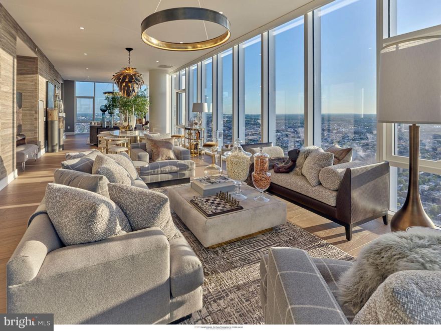 Presenting Penthaus 2 at Arthaus, an extraordinary testament to refined urban living situated in the prestigious Avenue of the Arts neighborhood in Philadelphia. This exceptional residence occupies Level 42 of the iconic Arthaus building, offering an expansive interior spanning 4,378 square feet, complemented by an exterior space of 292 square feet, providing awe-inspiring 360° views of the city skyline.

Step into a realm of unrivaled luxury as you enter through the grand foyer, where impeccable craftsmanship and elegance converge to create an unparalleled living experience. Boasting 3 bedrooms, 4 lavish baths, and an additional powder room, this penthouse sets the standard for sophistication and comfort. Indulge in the epitome of refined living with an expansive 52’ great room, perfect for entertaining. With Poggenpohl cabinetry, a full suite of Wolf/Sub-Zero appliances (gas cooktop), a sizable island, and a large butler’s pantry, the kitchen can accommodate serious cooks, whether that’s you or your favorite chef-for-hire. Penthaus 2 is the Penthouse Premier Show Home designed by local interior designer Jimmy Delaurentis. Every detail has been meticulously curated to elevate the art of hospitality to new heights.

Designed for those with discerning tastes, Penthaus 2 features two private balconies offering panoramic vistas of Philadelphia's iconic landmarks and dynamic cityscape. Whether you're basking in the morning sun or marveling at the city lights, these outdoor sanctuaries provide the perfect backdrop for relaxation and enjoyment.

Arthaus offers an unparalleled array of amenities, including a 75-foot indoor heated lap pool, a comprehensive suite of wellness offerings, and exclusive access to a BMW 750 with a personal driver. Residents can also enjoy the rooftop all-season greenhouse, dog run, and pet spa, along with an outdoor terrace featuring fire pits, grill stations, and al fresco dining areas.

Experience the pinnacle of urban luxury living at Penthaus 2, where every aspect has been meticulously designed to offer an extraordinary lifestyle. With its prime location steps away from renowned arts venues, fine dining establishments, and easy access to sports arenass and the PHL airport, Arthaus exemplifies the epitome of cosmopolitan living in Philadelphia.