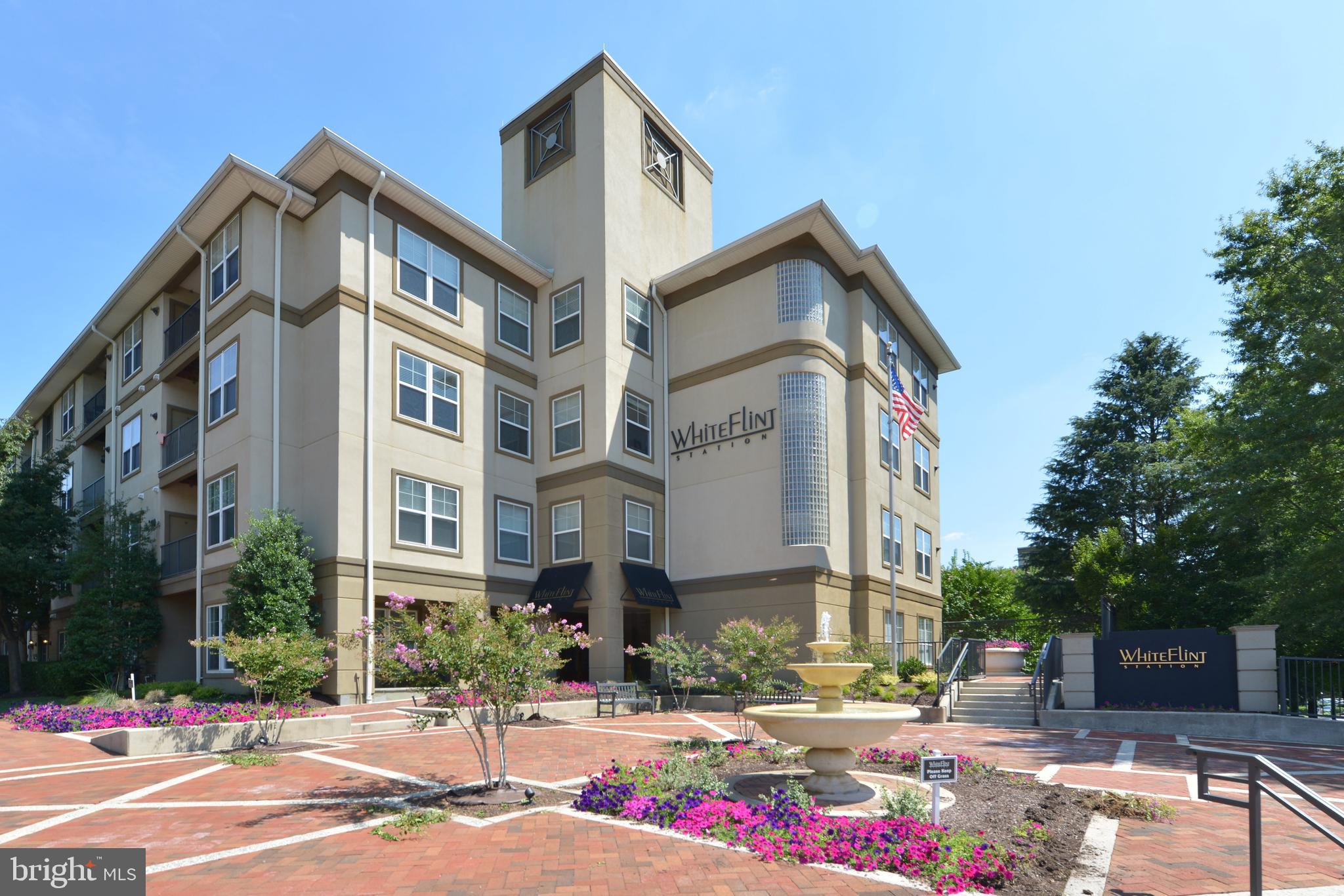 This sunny large two- bedroom two-bath mid-rise boutique condominium situated minutes to White Flint Metro, Pike & Rose and Harris Teeter. A perfect blend of location and a move in ready condo in North Bethesda. Unit 1207 has an open floor plan with beautiful hardwood floors, a wall of windows in the living room leading to a nice balcony to enjoy your cup of morning coffee! All new carpet in bedrooms with ample closet spaces. Good size kitchen with stainless steel appliances and granite countertops. A large separate laundry room and a nice computer nook with built-in for storage is a bonus! The building has many amenities such as business center, pool, fitness center, party facility, bike storage, and a on-site full time management. A short walk to metro, shops, and abundance of restaurants in the new Pike & Rose Plaza.