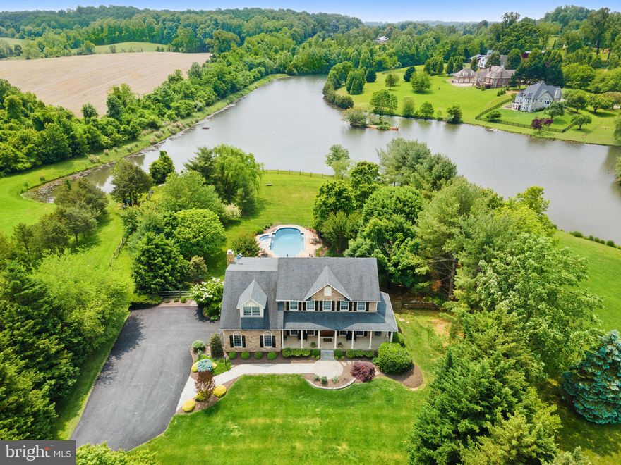 Set quietly and privately on 2.49 acres in a highly sought area...and just 2.2 miles from historic Main Street... this home's view is to die for! From the covered back porch, look through the mature, thoughtful landscaping that flanks your stylish pool to enjoy the long view of Leeton Lake. Your waterfront lot allows easy access to the private lake, professionally maintained for kayaking and fishing. The same lake view is found from the kitchen, living room, dining room and multiple bedrooms, with many custom features (2 walk-in closets with built-ins in primary bedroom!) and hardwood floors throughout. Let’s not forget your fenced yard! Your new home serves as the perfect setting for practical daily living, entertaining and quietly working from home (fast Internet!). There's space to leverage for recreation, comfort and lots of storage. If you're looking for a home that blends practical and unique, private lakefront living that is quiet yet convenient to downtown, this is your forever place! Wow your guests by revealing to them this hidden gem.