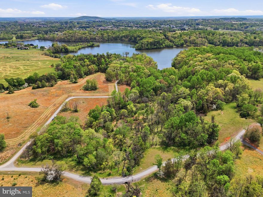 Discover the perfect blend of privacy, natural beauty, and convenience with this exceptional ready-to-build lot. Nestled within the established Eagles Nest community just outside of town limits, this 10.4-acre parcel offers a peaceful retreat surrounded by mature trees, and a picturesque stream running through the property. The lot is partially cleared with road frontage on two sides. High-speed internet is available making working from a home a breeze. Conveniently located just a short drive from downtown Culpeper, you'll enjoy easy access to local shops and dining while still relishing the peace and quiet of rural living. Health permit has already been filed with the county health department for a 4-bedroom conventional septic. Just bring your builder and vison! No HOA, but covenants in place.