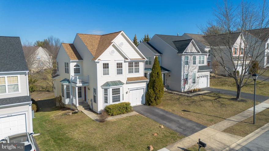 Here’s your chance!  An affordable single-family home in coveted Spring Ridge!  Perfectly situated on a quiet circle, this well-cared for home offers an open floor plan on the main level, with a bright, front sitting room, formal dining area and oversized family room, only separated by a knee wall.  The family room includes a gas fireplace with mantle and access to the sunroom with sliding windows and ceiling fan, perfect for bringing the outdoors in.  If that wasn’t enough, the sunroom opens to a recently stained deck with steps to access the backyard.  Open to the family room is the kitchen, complete with gas range, center island, pantry, recessed lighting and breakfast nook… and a few steps to the powder room, coat closet and access to the garage.  Upstairs, the modern primary bedroom comes complete with a vaulted ceiling and walk-in closet, with attached sitting area, perfect for a home office, yoga/meditation area or even exercise equipment.  This area includes shelving, a second closet for added storage and bright Palladian window.  The en-suite bathroom offers a corner soaking tub with separate shower and dual sinks.  Two ample-sized secondary bedrooms, another full bath and upper level, full-sized laundry complete this level.  The finished lower level includes a game room, finished den, storage/workshop area and rough-in for a 4th bathroom.  You can even walk out to the flat backyard.  Attached garage, fresh paint, NEW ROOF 2024, Expansion Tank 2024, Bosch Dishwasher 2022, W/D 2018… and all the amenities that make Spring Ridge so special!  ONE YEAR HOME WARRANTY INCLUDED!