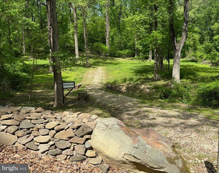 Nestled in the peaceful enclave of Riley Hollow, this beautiful wooded land  offers 5.25 acres of serene privacy, natural beauty, and convenient access. Stone walls frame the entrance from Riley Hollow Road, leading to a recently cleared potential building site under the canopy of towering poplars. A second entrance via the private Bolton Branch Lane leads to another possible homesite, where a house once stood—complete with an existing well and nearby power line.

The land features a wide walking path, clearly marked corners, and glimpses of Shenandoah National Park through the trees, with winter views from the upper portion of the property. Whether you're seeking a quiet getaway or a full-time residence, this property offers the best of both worlds: peaceful seclusion and easy proximity to Route 522, the charming village of Flint Hill, and commuter routes through Front Royal and Route 66. Outdoor enthusiasts will appreciate the nearby Park entrances at Front Royal and Thornton Gap, along with local trailheads at Bean Hollow and Chester Gap.

The offering includes two tax parcels (TM 4-1-5 cont. 5.17 acres & Tm 4-1-5A, cont. 0.0851 acre) totaling approximately 5.25 acres.
