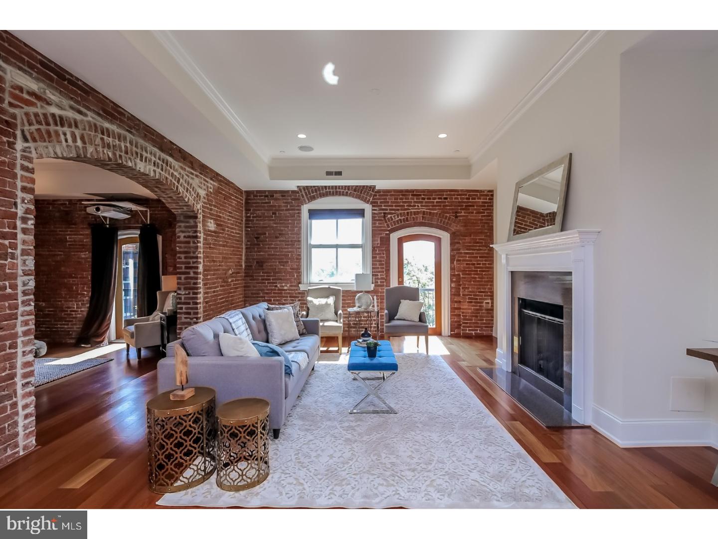 Magnificent three bedroom residence with private roof deck in a boutique luxury condominium building on Washington Square! Custom three bedroom plus den, three bathroom with private roof deck at The Lippincott on Washington Square. This magnificent home boasts a grand great room boasting a living room with fireplace and access to a balcony with wonderful sunrise city views to the east, as well as an open, adjacent dining room perfect for entertaining. The chef's kitchen features wood cabinetry, granite countertops, a Sub-Zero refrigerator/freezer, Wolf range with Best Hood, Asko dishwashers and breakfast bar. The master suite has two walk-in closets and an ensuite bathroom appointed in marble with two vanities, an over-sized stall shower, private commode and Jacuzzi tub. There are two additional bedrooms and bathrooms, a cozy den located off of the living room with exposed brick walls, and a laundry room with side by side washer and dryer.