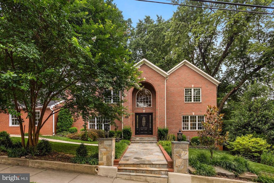 WOW! GREAT NEW PRICE.  6150 SF (tax record obsolete) on 3 levels with 7-9 bedrooms, 6 baths plus 2 powder rooms.  This substantial brick home with large pool-sized yard offers space for everyone.  Major remodel in 2015.    Ideal as a MULTI-GENERATIONAL or possibly EMBASSY property with:  1) a very open main level floor plan including a first floor  bedroom with bath;  2)  a SECOND main level family room with a full bath and  entrance adjacent to driveway; and 3) a large lower level with 3 more bedrooms plus kitchen and rec room and LARGE family area, with walkout to spacious rear garden.   Brazilian Cherry Floors. This house is literally right around the corner from KEY Elementary, and a short stroll to Macarthur Blvd amenities including Starbucks, Pilates, cafes etc.  Property to be sold strictly "AS IS", but inspections are welcomed.  Lower level fireplace decorative only.