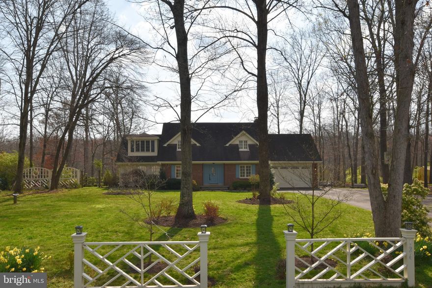 This beautiful custom 5 bedroom 3 and a half bath home boasts many amenities. The attention to detail in the wood work thru out this home is unsurpassed. There are built in book shelves, moulding, and much more. On the main level there is a  separate dining room with a fireplace, an office that overlooks the beautiful front gardens, a large living room off the gourmet kitchen and an additional light bright sunroom perfect for enjoying this gorgeous property, working out or anything you can imagine. There are four bedrooms upstairs and  2 full baths. The primary bedroom boasts a huge closet with shelving. The bath has separate sinks, a tub and a large shower. The walk up basement has another bedroom, full bath, laundry room and storage galore. There is a large 2 car garage and a semi fenced large back yard. This home is great for relaxing and living surrounded by nature just minutes from parks, shopping, acccess to everything and Dulles airport. Vacation at home in this amazing property.