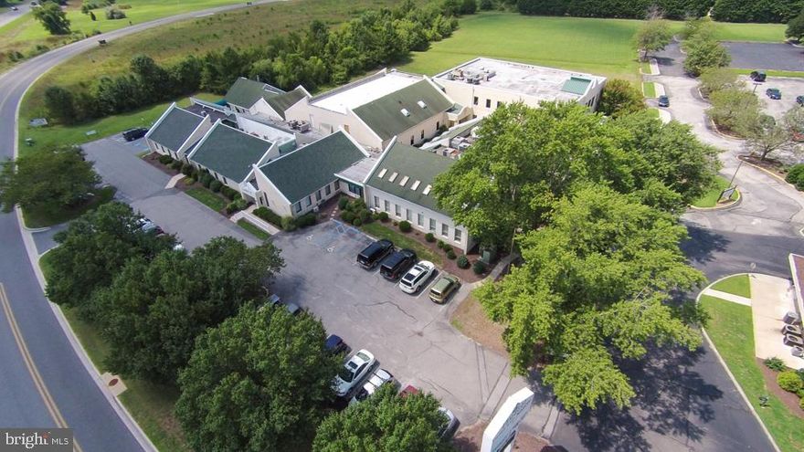 Large office complex with multiple tenant layouts 
Approximately 2.5 acres of paved parking area and 4.25 acres of cleared land
5,500 Square feet of office space was recently completely  renovated to Class A space
Entire complex has fire monitoring, there is an elevator for access to a majority of the second floor spaces and all areas are ADA compliant
Several tenants are in place with short term leases (rent roll available upon request)
Perfect opportunity for redevelopment 
Three adjacent parcels along Philip Morris Drive (see documents tab) are available to increase the site size or provide additional ingress/egress