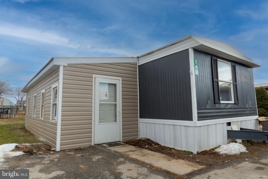 Welcome to this updated 3-bedroom, 1-bathroom mobile home offering just over 900 sq. ft. of comfortable living space! The spacious kitchen boasts solid wood cabinets, granite countertops, and a dishwasher. Two bedrooms are located in the main home, while the finished addition provides a third bedroom and convenient laundry hookups. Lot rent is $410 per month and includes trash collection. Water and sewer are billed by the park at a base rate of $55 per month, based on water consumption of 2,000 gallons. This home is priced to sell—don’t miss your chance! Schedule your showing today!