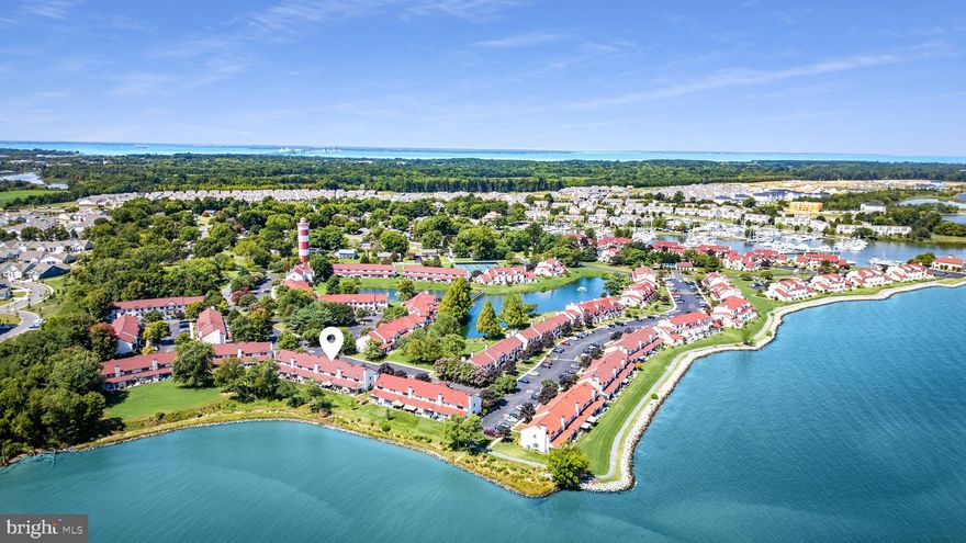 Under contract with a home sale contingency and kick-out clause; seller is actively accepting showings and backup offers!! Welcome to Queens Landing, where resort-style living meets the comfort of home. This beautifully updated townhome offers 1,440 square feet of thoughtfully designed living space plus an open sunroom, adding approximately 160 additional square feet, creating a seamless and spacious floor plan ideal for everyday living and entertaining.

Enjoy panoramic water views from every room - lake and fountain views from the kitchen and second bedroom, serene Macum Creek views from the living area, and expansive Chester River vistas from your sunroom and private patio. Wake up to breathtaking sunrises and wind down under the motorized awning as boats pass by in the distance.

This two-bedroom home features dual en-suite baths, including a fully remodeled primary bathroom with a custom walk-in shower and sliding barn door. The kitchen is equipped with newer, beautiful soft-close cabinets, sleek countertops, modern appliances, and an extra pantry for added storage. Luxury vinyl plank flooring flows throughout the main level, while plush carpeting offers comfort upstairs. Additional highlights include a newer HVAC system, water heater, and fresh paint throughout. An expansive attic and a dedicated storage room provide plenty of space to keep your belongings organized and out of sight.

The building exterior was rehabilitated in 2018, including new windows, and a 30-year architectural shingle roof was installed in 2021. All required annual inspections have been completed, ensuring peace of mind.

Queens Landing offers unmatched community amenities including a waterfront pool, fitness center, clubhouse, pickleball and tennis courts, walking trails, and kayak launch areas—all just minutes from Route 50 and the Bay Bridge. This is your opportunity to own a turn-key waterfront lifestyle in a vibrant and well-maintained community.

The seller is also offering a 30-foot boat slip at the Queens Landing Marina with dues paid until March of 2026 and is selling a 2019 Sportsman 28-foot center console boat (grey/white with twin 200 Yamaha engines), available separately upon request. It’s the perfect combination for any boating enthusiast; a true boater’s dream.