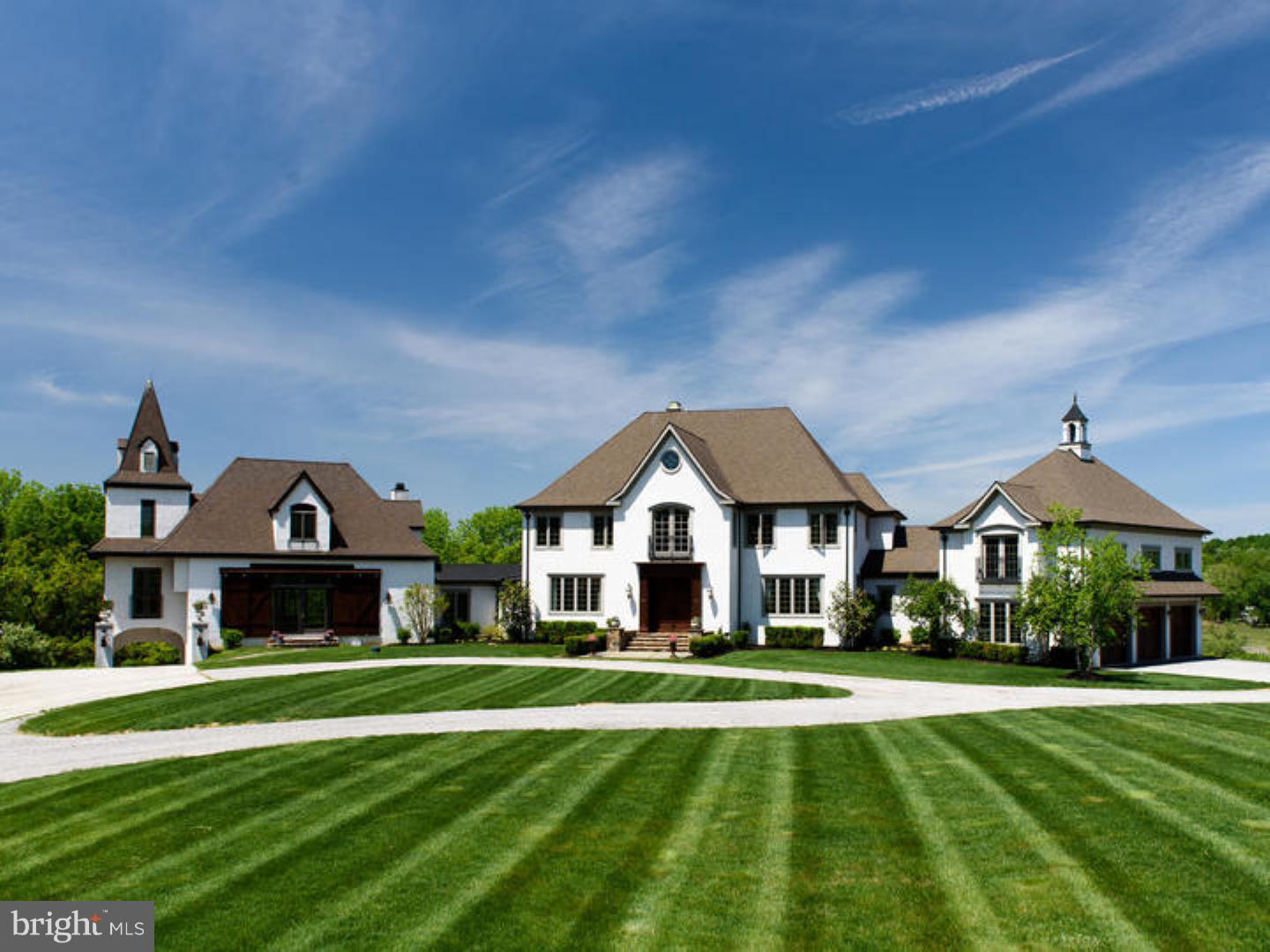 Could not be replicated at this price...This exquisite European Manor Home rests majestically upon over 23 rolling acres of Chester Springs countryside. The extremely well-appointed main residence features open, beautiful entertaining spaces, as well as welcoming, family living areas. With 6 Bedrooms and 6.5 Baths, this breathtaking 9,500 square foot home includes a gracious central Entrance Hall with marble floors and curved stairway with Gallery; a formal, Living Room and a Dining Room, each with spectacular millwork, built ins and views of the magnificent grounds. Also on the main level are the impressive Library with spectacular built-in bookcases, a Sun Room, and a spectacular "Sugarbridge" chef's Kitchen with 2 Islands and professional grade appliances. Ascend the grand central staircase with superbly crafted iron rail to find the incredible Master Bedroom Suite with a gas fireplace, marble bath with footed soaking tub and walk-in closets. Completing this space are a large landing, plus three additional Bedrooms with private Bathrooms. The bright, walkout Lower Level with high ceilings offers a wonderful recreation area, indoor Basketball Half-Court, additional Bedroom and Bathroom. The attached, 2 Bedroom Guest House features an enormous, 2 story Great Room with fireplace, the warmth of high knotty pine, and opens on 2 sides to bring the spectacular outside in. Overlooking a pasture and a stream, Pine Creek consists of 24 home sites on 235 acres which are part of a 450+ acre deed restricted neighborhood of woods, ponds, streams, meadows and a horse trail. All idyllically sited close to major highways, wonderful restaurants & shopping.
