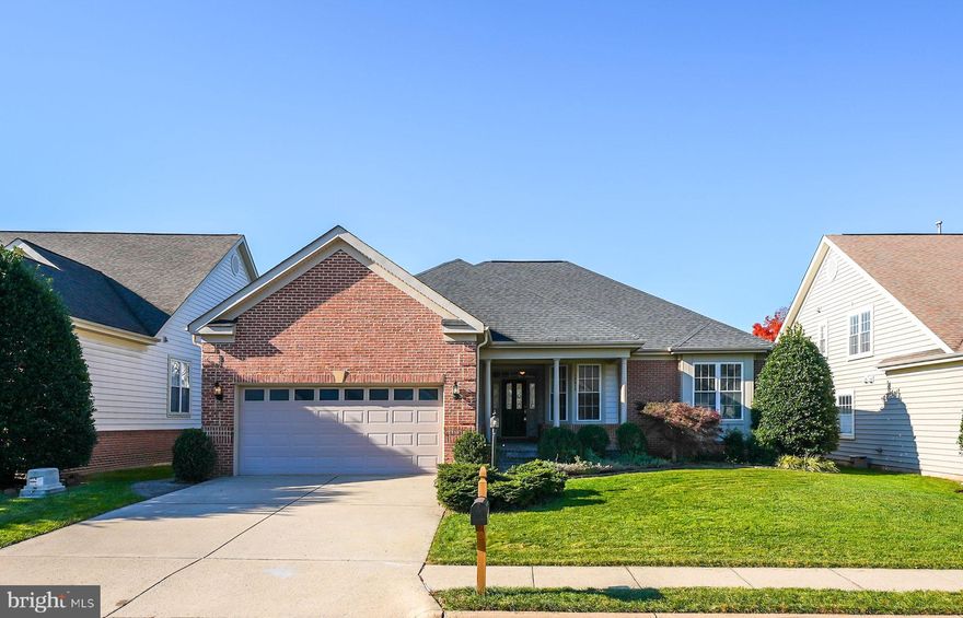 This sought after Tigerlily with 16th Fairway views is sure to delight! So many custom details from the brick lined custom flagstone walkway and porch, to the whole house built in sound system.  Walk into the large Great room at the heart of the home, with its vaulted ceiling,  gleaming hardwood floors and a gas fireplace. Or relax in the sunroom with skylights, overlooking the deck and out to the 16th Fairway views!  A formal dining room features crown molding and chair railing.  Office with double, glass panel french door and recessed lighting. The kitchen features Corian counters, custom tile backsplash, an island, and peninsula with barstool seating available, with a bright breakfast room able to accommodate a large table. The primary suite in the rear of the home provides a private retreat with an en-suite bathroom and walk-in closet. The main floor is rounded off with a guest bedroom in the front providing a quiet space for visitors and a full guest bathroom. Downstairs a huge recreation room with pool table that conveys. and wet bar with mini fridge and wine rack, and plenty of space for seating will be the backdrop for all your entertainment needs. The media room is the perfect place for movie night and comes with surround sound a TV stand, and media components, just bring your TV and plug it in! The basement has 2 bonus rooms (currently a guest room and craft room), and a library nook! A large unfinished room has a workbench and loads of space for your storage needs, Recent improvements include Custom Paint color "Cream in My Coffee" (2024), HVAC (2019), Roof (less than 10 years old), Water Heater (2012). Don't miss the wealth of neighborhood amenities Heritage Hunt has to offer, including trash and snow removal, Comcast digital TV, HDTV, high-speed internet service, 2 clubhouses, all new pickleball courts, bocce ball, croquet, tennis, walking paths, ponds, common areas, community clubhouse, dining room and lounge, and access to a full calendar of events. The neighborhood is centered around an 18-hole Arthur Hills golf course w/a pro shop. The Fitness Center includes an exercise room, yoga room, fitness and aquatic classes, and indoor and outdoor pools. This home is located in Heritage Hunt-- a gated Active Adult community. One permanent resident in the home must be age 55 or older. The HOA fee is $380/month and the purchaser will pay a one-time capital contribution fee of $4,560.00 at settlement. Located near the community are shopping centers, medical offices, restaurants, and many additional community services.