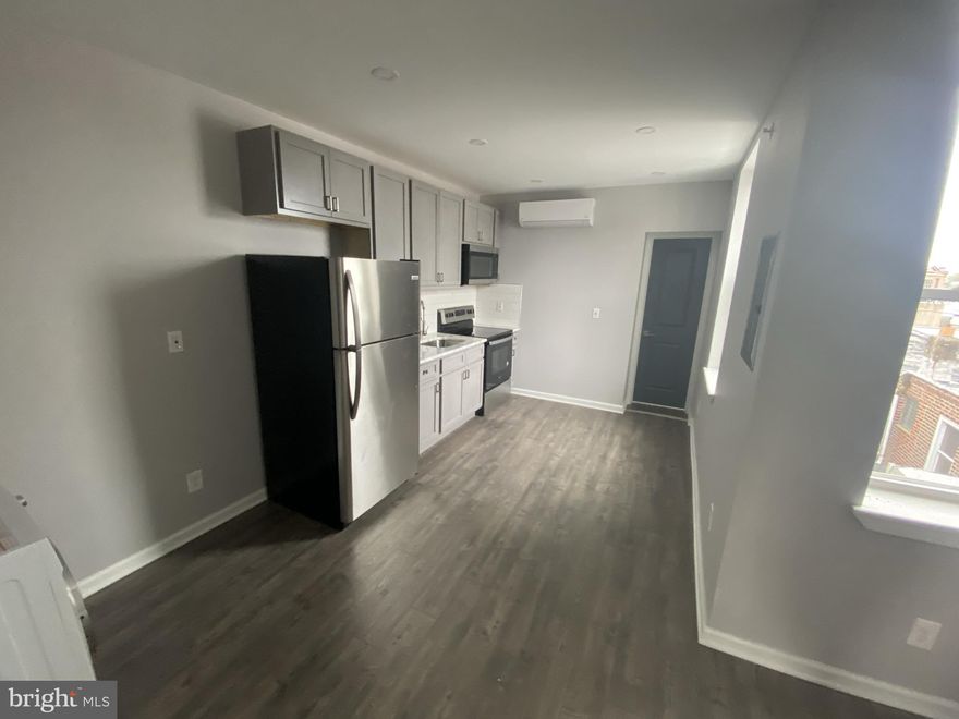 Two bedroom apartment with in-unit all in one washer/dryer combo. Quiet tree-lined street, just steps to E Passyunk Ave, Columbus Square Park and the Broad Street Line. This apartment features a renovated kitchen with stainless steel appliances, three piece full bathroom and two bedrooms. Tenant responsible for $50/month flat fee for water.