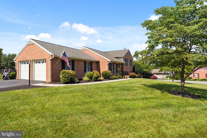 Nestled in the Colonial Park East Community, just moments away from Mertius Medical Center, HCC, and convenient access to Dual Highway, shopping, dining, and Interstate 70, this charming home is over 2,300 Square Feet. All-brick split-level home occupies a corner lot with a fully fenced backyard featuring decorative black aluminum fencing. The open-concept design boasts vaulted ceilings on the main level and laminate flooring throughout, with hardwood flooring beneath. The living room flows seamlessly into the dining area, which offers access to a stunning brick patio. The well-appointed kitchen showcases an island, tile flooring, granite countertops, stainless steel appliances, a gas range, and skylights. The upper level is carpeted with Berber, featuring two bedrooms and a spacious full bathroom equipped with tile flooring and granite countertops, including a tub/shower and a skylight. The first lower level features a cozy family room with laminate flooring and a gas-burning fireplace, complete with built-in custom shelving. The master bedroom is also located on this level, alongside a full bathroom with a walk-in tile shower and a laundry room. The second lower level provides a large open area with vinyl flooring. Additional amenities include an attached two-car garage with direct access to the main level and an ample storage shed.