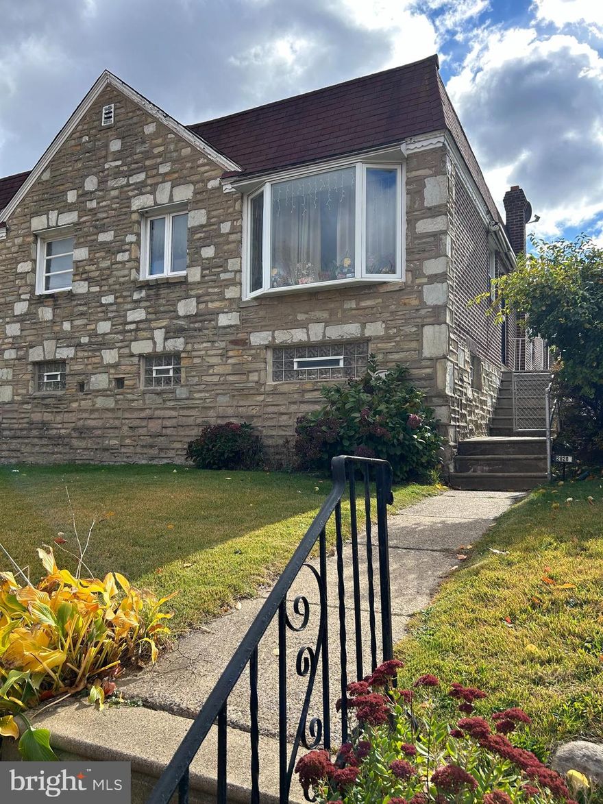 Great opportunity! This well maintained twin ranch is ready for your updates.  Large semi with a finished basement and a summer kitchen in the basement. Hardwood floors and ceramic tile floors. Rear one car garage with a driveway and separate parking pad.. BRAND NEW HEATING AND A/C. The side yard is fenced in too. Great location close to shopping and restaurants.