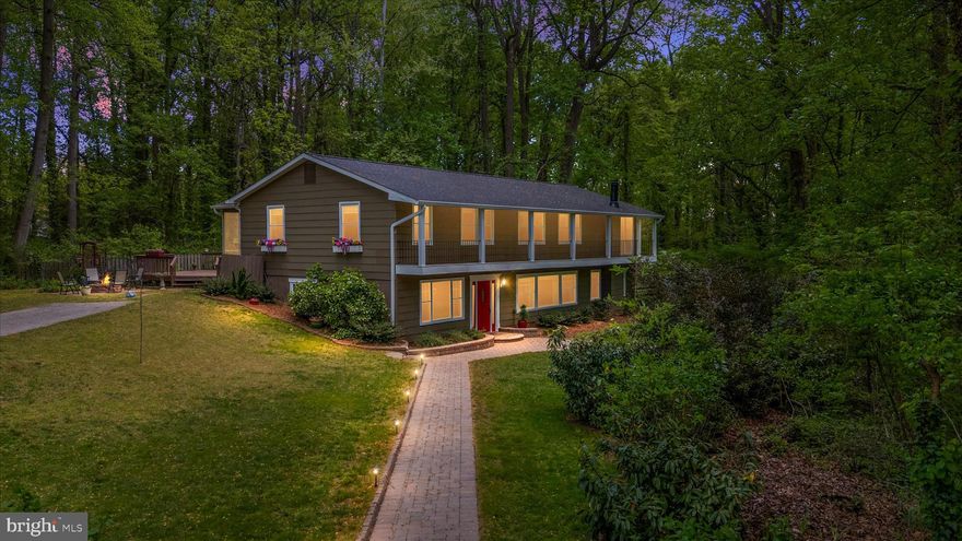 Welcome to 923 Buttonwood Trail, a spacious two-story Colonial nestled in the highly sought-after, water-privileged community of Herald Harbor. Offering +/- 3,100 finished square feet of above-grade living space, this charming detached home features four bedrooms, two full bathrooms, and one half bathroom, and boasts over $123,000 in thoughtful upgrades and major system replacements.
The interior boasts a versatile, expansive floor plan and upgraded six-panel doors. The main level provides ample room for entertaining and everyday living, featuring a welcoming living room and a formal dining room—both showcasing beautiful wood floors and elegant 6-inch molding—as well as a dedicated study/family room. The heart of the home is the eat-in country kitchen, offering comfortable table space, a bright bay/bow window, beautiful granite countertops, engineered hardwood floors, and is fully equipped with an electric oven/range, dishwasher, refrigerator with icemaker, and range hood. You can also gather around the cozy, completely refurbished brick fireplace.

Upstairs, the generously sized bedrooms provide ample comfort with brand-new carpet (installed in 2025) and a beautifully tiled upper entryway. The convenient upper-level laundry room includes a recent washer and dryer set (2025). The primary bedroom suite is a true retreat, highlighted by its own relaxing sitting area and a custom-redesigned, expanded walk-in closet. Additionally, all bathrooms throughout the home have been stylishly updated.

This unique offering includes a double lot totaling 0.63 acres, providing a serene, private setting complete with professional landscaping that backs onto mature trees and woods. Enjoy winter water views and beautiful surroundings from multiple outdoor spaces, highlighted by a huge screened-in porch perfect for relaxing or entertaining. The exterior is an absolute oasis featuring a welcoming front porch with a custom paver walkway, a balcony, a rear deck, a fire pit patio, a tranquil koi pond, a convenient storage shed, and a yard enclosed by a charming split-rail fence.

Equipped for year-round comfort and ultimate peace of mind, the home features a reliable, recently replaced HVAC heat pump system (2021) providing efficient central A/C and heating, a brand-new architectural shingle roof with oversized gutters and downspouts (2026), and a newly installed public water line from the street (2023). Other exterior amenities include a recently resurfaced asphalt driveway (2020) for ample off-street parking and an existing septic system.

Located just six blocks from the Severn River, you can enjoy all the benefits of the Herald Harbor neighborhood with no HOA rules or fees—only a voluntary association fee that grants you the incredible benefits of community water access. Don't miss the opportunity to make this meticulously maintained Crownsville retreat your own!