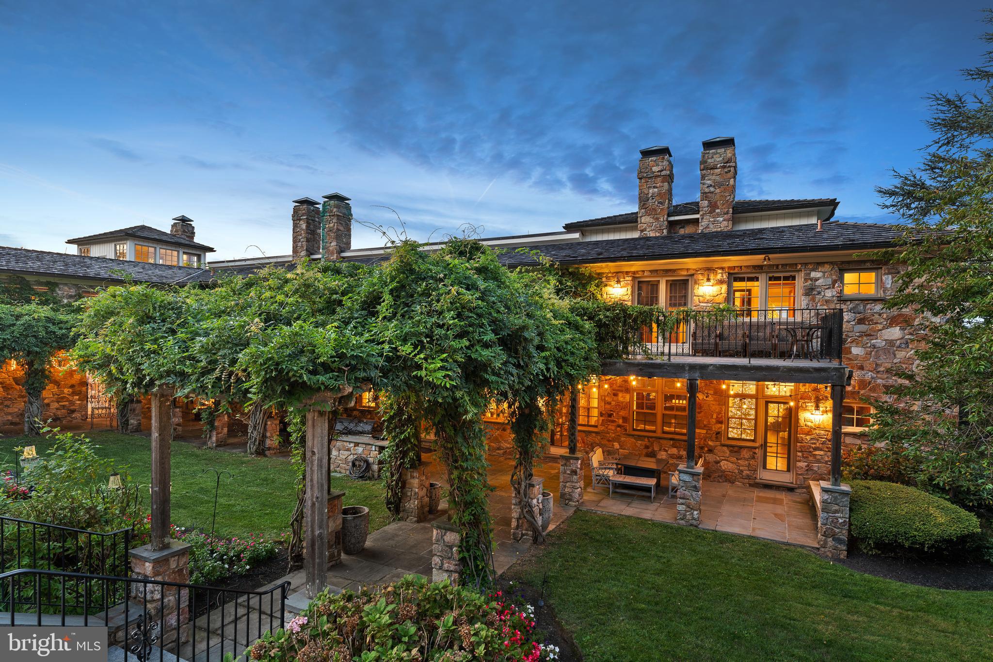 NEW PRICE for this Spectacular European Inspired Manor Home set on 36.6 bucolic acres with endless views of the surrounding countryside. Incredible sunsets and sunrises from all rooms in this Manor Home. This incredible 5 Bedroom, 7.1 bath home has impressive stonework throughout the property both inside and out. A spacious and open floor plan has a soaring vaulted 2 story great room showcasing exposed beams, stone fireplace and French doors to a balcony for easy entertaining. The gourmet kitchen has high end appliances, granite countertops, coffee bar, breakfast area and French doors leading to a terrace, pool with pool house and beautiful gardens with a waterfall. There is a formal dining room with cathedral ceiling, built-ins, stone fireplace and French doors accessing a lovely, covered terrace with an amazing formal rose garden with trellis surrounded by stone walls. Perfect for entertaining and that special occasion! The first floor is complete with a living room and library/den both with fireplaces, enclosed porch, mud room and powder room. The second floor has a luxurious primary suite with fireplace, balcony, coffee bar and two primary baths, one with access to a deck overlooking the gardens, waterfall and pool, perfect for morning coffee. There are 3 additional en-suite bedrooms, laundry room, office and exercise room on the second floor with its own entrance and access to a private terrace. The lower level has an en-suite bedroom, a large rec room and a family room with full bath, sauna and wine cellar, also could be a second en-suite bedroom. All have access to beautiful gardens and manicured lawns. This high-end home has 600-amp service, radiant heat floor throughout, On-demand hot water heaters and a 100 KW Mercedes Diesel Whole House Generator. The barn was converted and is currently being used as office space with radiant heat floor, kitchen and a two-bedroom tenant house with a full kitchen and living room. Perfect for a small business in a private and peaceful setting. For the equine enthusiast the 10-stall center aisle barn could be converted back. There are 5 paddocks with turnout sheds, automatic waterers and a full-size outdoor ring with lights. Completing the barn area is a new 6-car garage with electric and generator as well as an equipment shed for additional storage, perfect for the car enthusiast. Bordered by the Green Valley Watershed association and acres of conserved land. The Green Valley Watershed is a 197-acre nature sanctuary and arboretum. This property has two tax parcels separated by the Beaver Run Creek and has a French & Pickering Creek Conservation Easement. The partial easement is on 15 of the 36.6 acres, which include the front 13-acre parcel and the back 2.2 acres that borders Welkinweir. The 2.2 acres is in East Nantmeal Township. The remainder of the acreage with the house is in South Coventry. The farm is a perfect location for the commuter with easy access to the PA turnpike, Exton, West Chester, Main Line, shopping and much more!