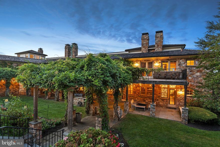 NEW PRICE for this Spectacular European Inspired Manor Home set on 36.6 bucolic acres with endless views of the surrounding countryside. Incredible sunsets and sunrises from all rooms in this Manor Home. This incredible 5 Bedroom, 7.1 bath home has impressive stonework throughout the property both inside and out. A spacious and open floor plan has a soaring vaulted 2 story great room showcasing exposed beams, stone fireplace and French doors to a balcony for easy entertaining. The gourmet kitchen has high end appliances, granite countertops, coffee bar, breakfast area and French doors leading to a terrace, pool with pool house and beautiful gardens with a waterfall. There is a formal dining room with cathedral ceiling, built-ins, stone fireplace and French doors accessing a lovely, covered terrace with an amazing formal rose garden with trellis surrounded by stone walls. Perfect for entertaining and that special occasion! The first floor is complete with a living room and library/den both with fireplaces, enclosed porch, mud room and powder room. The second floor has a luxurious primary suite with fireplace, balcony, coffee bar and two primary baths, one with access to a deck overlooking the gardens, waterfall and pool, perfect for morning coffee. There are 3 additional en-suite bedrooms, laundry room, office and exercise room on the second floor with its own entrance and access to a private terrace. The lower level has an en-suite bedroom, a large rec room and a family room with full bath, sauna and wine cellar, also could be a second en-suite bedroom. All have access to beautiful gardens and manicured lawns. This high-end home has 600-amp service, radiant heat floor throughout, On-demand hot water heaters and a 100 KW Mercedes Diesel Whole House Generator. The barn was converted and is currently being used as office space with radiant heat floor, kitchen and a two-bedroom tenant house with a full kitchen and living room. Perfect for a small business in a private and peaceful setting. For the equine enthusiast the 10-stall center aisle barn could be converted back. There are 5 paddocks with turnout sheds, automatic waterers and a full-size outdoor ring with lights. Completing the barn area is a new 6-car garage with electric and generator as well as an equipment shed for additional storage, perfect for the car enthusiast.  Bordered by the Green Valley Watershed association and acres of conserved land. The Green Valley Watershed is a 197-acre nature sanctuary and arboretum. This property has two tax parcels separated by the Beaver Run Creek and has a French & Pickering Creek Conservation Easement. The partial easement is on 15 of the 36.6 acres, which include the front 13-acre parcel and the back 2.2 acres that borders Welkinweir. The 2.2 acres is in East Nantmeal Township.  The remainder of the acreage with the house is in South Coventry. The farm is a perfect location for the commuter with easy access to the PA turnpike, Exton, West Chester, Main Line, shopping and much more!
