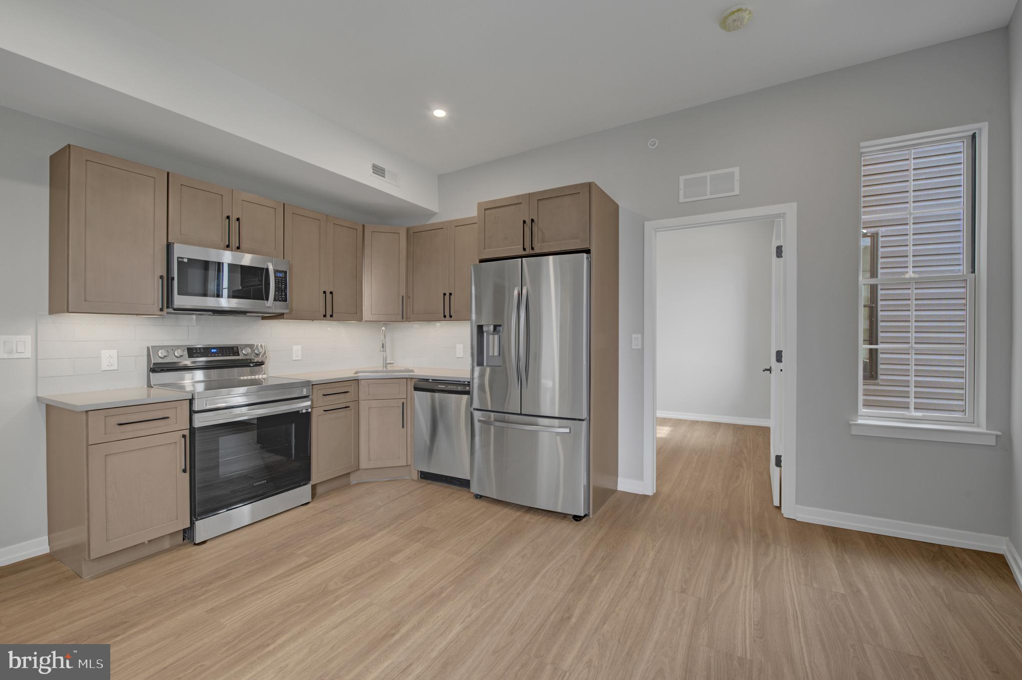 Welcome to Innovator Village, nestled in the heart of Graduate Hospital! This gated community is home to 82 brand new construction, luxury units featuring top of the line finishes. 2445 Innovator Way offers everything you could desire in a city apartment and can be moved into immediately. This unit features a spacious, open living room with huge windows and lovely natural light, a kitchen with quartz countertops and stainless steel appliances, a beautiful bathroom, hardwood floors and an in unit washer/dryer. The building features a shared roof deck with beautiful views of Center City. Innovator Village is located on the bustling Washington Ave corridor with easy access to Drexel University, CHOP, Penn University, I76, restaurants, shops, public transportation and much more! On site parking is available for lease for $300/month (currently a waitlist, no parking available immediately).
