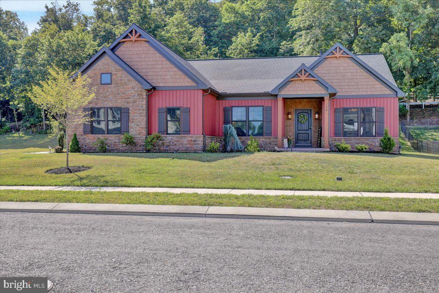 Welcome to 156 Forge Drive located in the heart of Cornwall, across from the famous rail-trail and root beer barrel on a premium lot in Cornwall Junction.   Also close to Mount Gretna, the PA turnpike, schools, shopping, banks, hospitals, and doctors' offices. This beautiful home is move in ready and is ready for immediate occupancy.  As you drive up to this home, you will start noticing the upgrades to this custom-built ranch home, including the board and batten siding, stone exterior, bronze windows, covered front porch, and three-car garage. When entering this home, you will notice the open layout consisting of a front room, currently used as a game room with a lighted tray ceiling, a double-sided floor to ceiling stone fireplace, and a large great room with a cathedral ceiling and built-in bookshelves. The spacious kitchen offers quartz countertops, tile backsplash, and a very large island with seating for four. Next to the kitchen, you will find a breakfast nook for formal dining. Upon entering the primary bedroom, you will see the tray ceiling with crown molding and additional closet space. The primary bathroom is perfect for relaxing in the hydrotherapy soaking tub next to the Brazilian teak wall. This bathroom also has a separate tile shower and walk-in closet. The basement features a Superior Wall foundation which could be easily finished for a third bedroom if needed. French doors separate the great room from the stamped concrete back patio featuring a 16 x 20 area with a covered cathedral ceiling with wood beams and bronze railing and an uncovered stamped concrete patio for those who want to take in the sun, overlooking the large back yard. Why go through the hassle of building when all the decisions have already been made. Priced to Sell!! No HOA. Please see the list of upgrades under documents.