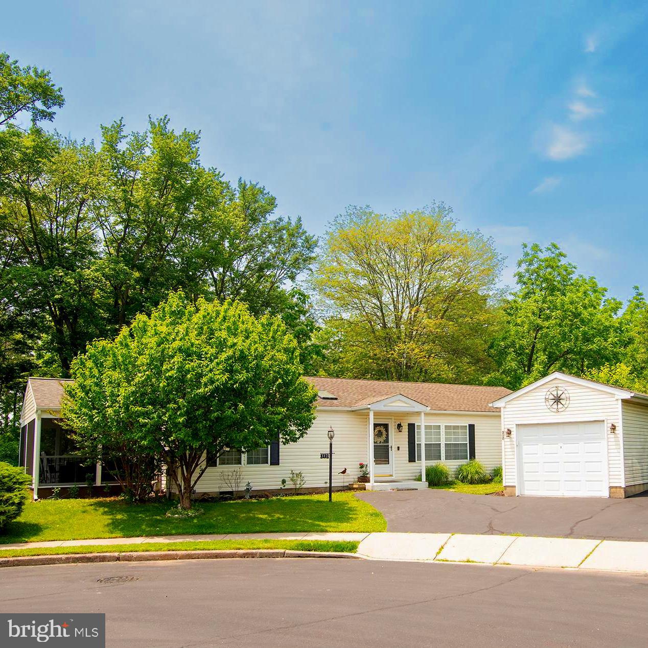 This is the one you’ve been waiting for! There hasn’t been a home for sale in
this 55+ community for over a year! NO LAND LEASE!
Welcome to 312 Farm Lane, located in the highly sought-after Gwynedd Woods 55+ Community. This beautifully updated and meticulously kept home is located in quite possibly the most private section of this community, offering peace, tranquility, and an abundance of natural light throughout. The front door opens into the main living area of the house that has an open floor plan to the dining room. The main bedroom is to the right of the living room featuring a large walk-in closet and an adjoining updated full
bathroom. The charming remodeled kitchen has new cabinets, granite countertops, stove, dishwasher, and a kitchen peninsula, offering extra seating and plenty of storage. The large sink has a window view of the
wooded backyard. Conveniently adjacent to the kitchen is a laundry room providing plenty of workspace and extra storage. Next to the dining room is a family room with direct access to the screened and covered deck/sunroom. This additional 220 sq ft of space is a beautiful retreat, complete with Trex decking and vaulted ceiling. The 2nd bedroom is located privately on the other side of the home, along with another updated full second bathroom.
Don’t miss the detached garage outside, in addition to the home backing up
right to the woods, a secluded wooded area…such a beautiful oasis of a yard!
Highlights of this home include:
Both bathrooms were updated in 2022
The kitchen was remodeled in 2022
The screened deck/sunroom was added in August of 2023
The entire interior of the home was freshly painted in 2022
New flooring throughout the home (2022)
New garage roof (2023)
New gutters/downspouts (2023)
This house just needs you to move right in! There is no land lease in this community, and the HOA is under $200/month! The association fee covers trash/recycling, snow removal (roads, sidewalks, and driveway apron), and sewer. It also includes use of the clubhouse, which offers many activities throughout the year for the residents of this community.
Schedule your showing today!
**ADDITIONAL photos to be added by Thursday**