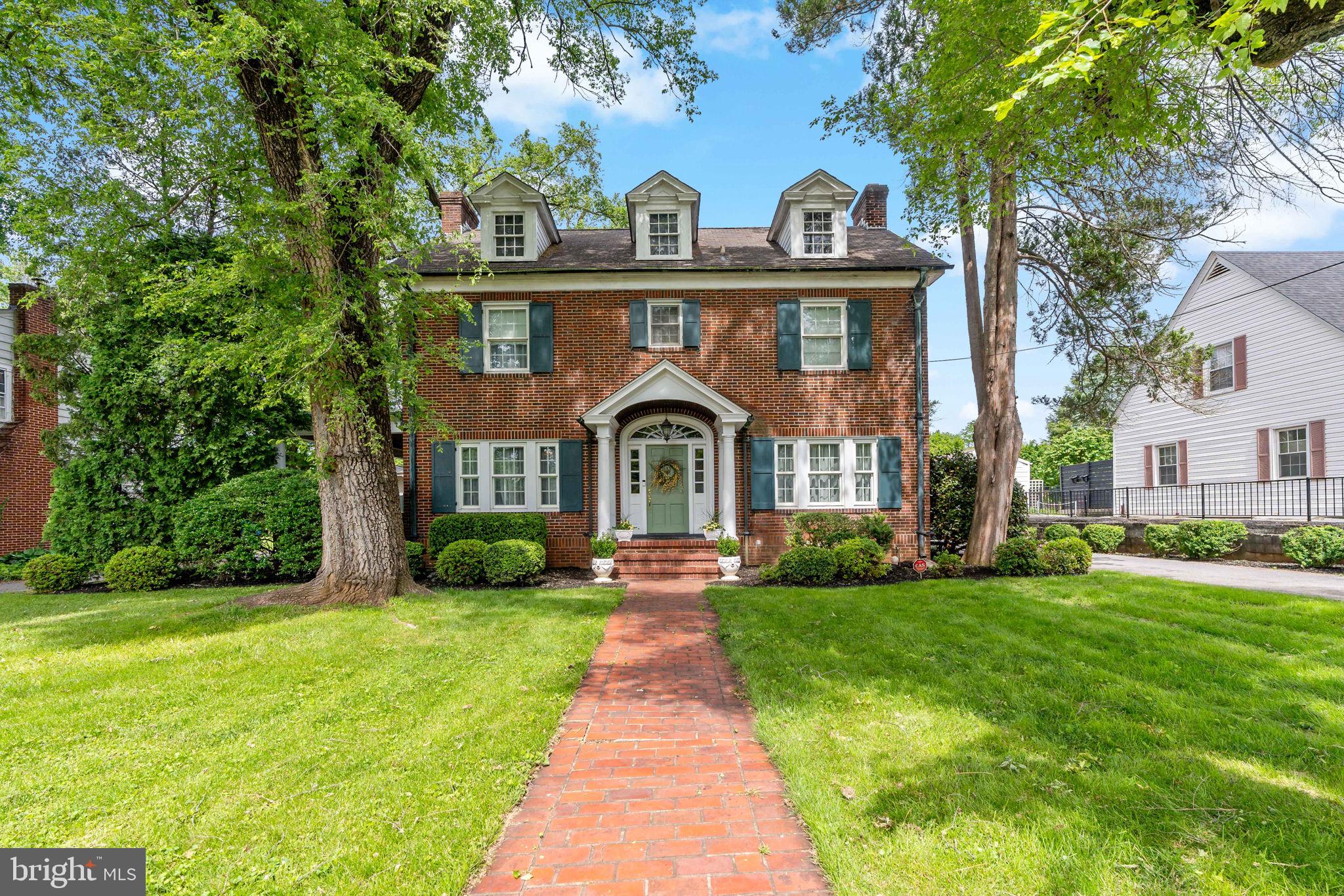 ABSOLUTELY CHARMING HOME IN ONE OF BERKELEY COUNTY'S MOST DESIRED NEIGHBORHOODS! Timeless charm in this classy home in the prestigious and established West-end area of Martinsburg. Outside, this home has a timeless curb appeal. Extensive perennial landscaping and mammoth trees provide a captivating foreground for the covered side porch and abundant parking on the side and frames the private private backyard, complete with arbour and quaint brick patio in the rear. Inside, the home is bright and airy, with lots of natural light and beautiful hardwood floors. Large living room with fireplace leads to a fantstic cozy covered side porch. The kitchen is a culinary delight with a natural gas stove, contrasting Quartz countertops, and a large island. The lower level has a huge recreational room with a cozy gas fireplace. All the bedrooms are generous in size and with one that double a great den, a upgraded modern bath completes the upper level. Despite the private setting, the home is only moments from I-81, schools, the hospital, medical offices, restaurants, grocery stores, and other retail establishments. This home has it all. Schedule an appointment to tour it today!