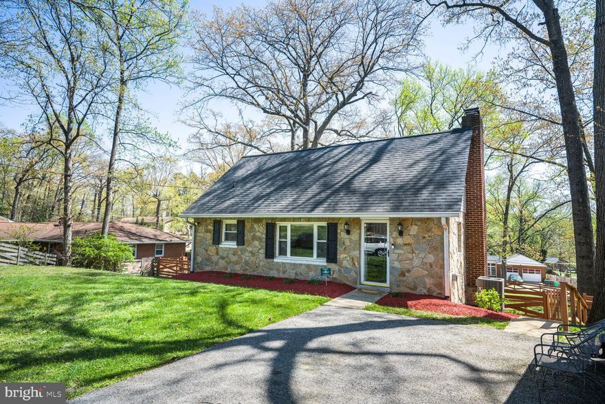 Charming Cape Cod with Modern Upgrades & Endless Possibilities! 
We are so excited to bring this  beautifully updated 4-bedroom, 2-bath Cape Cod in the sought-after Woodlane neighborhood to the market. From the moment you arrive, the timeless flagstone exterior and inviting curb appeal set the stage for a home that blends classic charm with modern convenience.
Step inside and fall in love! The gourmet kitchen is a dream, featuring custom cabinetry, upgraded stainless steel appliances, a wine refrigerator, and sleek countertops—perfect for the home chef or entertainer. The light-filled family room is warm and welcoming, with a cozy wood-burning fireplace, creating the perfect space to unwind. The primary bedroom and bath are conveniently located on the main level, offering comfort and privacy. Upstairs, you’ll find two spacious bedrooms, each with plenty of natural light and charm—perfect for family, guests, or a home office.
The finished lower level is a game-changer! With its pellet stove, spacious family room, private 4th bedroom, and full bath, this space is as versatile as it is inviting. Need extra storage? No problem—there’s plenty, plus a conveniently located laundry area.
Love the outdoors? Step into your own backyard oasis—.34 acres of fully fenced privacy, perfect for relaxing or entertaining. Spend your evenings around the fire pit, roasting marshmallows and making memories, or unwind on the covered porch with a cup of coffee and a good conversation. The spacious concrete pad, complete concrete pad for gazebo, is a great cozy spot to lounge with friends and family. With room to breathe and space to gather, this backyard feels like home in all the best ways.
And there’s more! The separate entrance to the lower level offers endless possibilities—a private home office, in-law suite, guest quarters or flex space to suite your needs.
Practical perks? We’ve got them! This property also features a spacious driveway for up to four vehicles - including your RV or camper - with a dedicated 30 amp RV outlet.  You'll never have to worry about parking, and with it's convenient location between DC and Baltimore, you're perfectly positioned for both work and play.