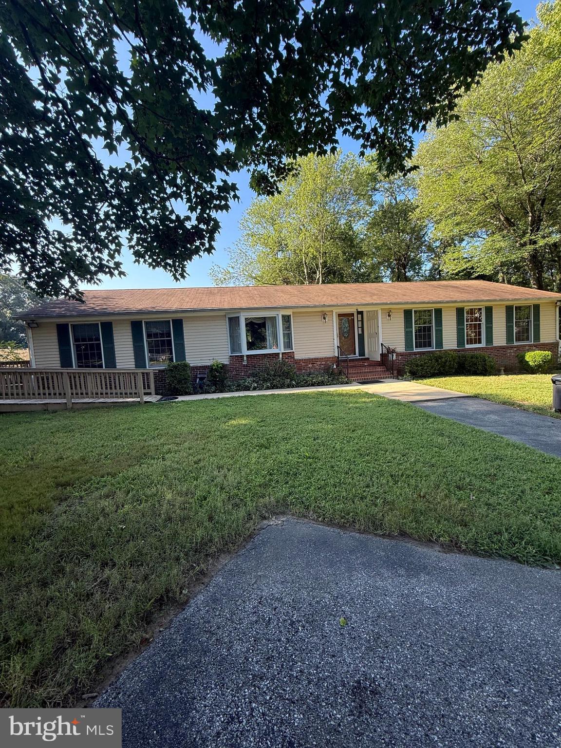 SERENITY AND SPACE IN CLINTON ON ALMOST 1 ACRE! This Beautiful well maintained 1 level Rambler is very special. It has 3 good size bedrooms, and 2.5 BA , a formal living room with a large picture window and a dining room with gleaming hardwood floors and a built in butler's pantry. The spacious Master bedroom is bright and has it's own private master bathroom with a window, double sinks, double closets , a walk in shower(no tub) and private watershed (toilet). The 2 other bedrooms have large closets and share a full sized hall bathroom with lots of natural light from a skylight and has a shower/tub combination. The eat in kitchen has natural light from another skylight and overlooks the spectacular large open partially private wooded backyard. There's beautiful blue Italian ceramic tile flooring, stainless steel appliances, nice ample wood cabinets, a huge pantry , utility room( HWH) and separate laundry with W/D. The kitchen is connected to an oversized family room extension with recessed lighting , a powder room and a small walk-in closet, perfect for relaxing and for quality family time gatherings. There's also a small office area. There is a door leading to the front side ramp ( business/deliveries/ handicap accessible). and a door opening onto the rear deck. There is plenty of off street parking in a driveway large enough for 5+ vehicles. This is an AS-IS sale. Clinton is a great location just 15 minutes from AAFB and only 20 minutes to DC. National Harbor and Alexandria , VA are short drives away. This home is warm, inviting and truly very special.