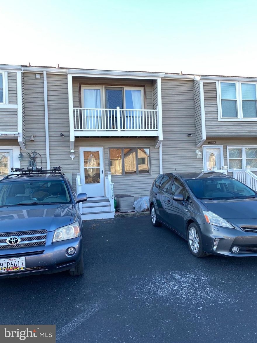 This 2 level townhome has fabulous bay views. It's located in the popular residential community of Caine Woods. There are two waterfront balconies. The sale includes a  boat slip with boat lift. There are NO CONDO FEES.  Park right by your front door for ease and convenience. Seller wishes to enter into a 1031 tax deferred exchange at no cost to the buyer. Property is occupied and requires 48 hours notice to be shown.