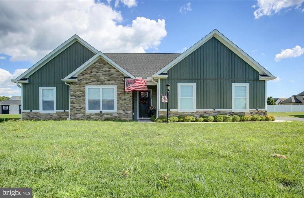 LIKE NEW! This 4 year young 3 bdrm, 2 bath rancher in Grand Point Crossings is in excellent condition includes kitchen appliances, washer, dryer & window treatments. Located close to everything--shopping, restaurants & medical services, the flat backyard and no steps access make this quality home a great place to retire or start your family. Enjoy the upgrades: arched entry into Great Room, open floor plan with vaulted ceilings, kitchen w/center island & granite counters, LVP flooring, primary ensuite w/tray ceiling & large walk-in closet, 36" doors throughout & 14x12 rear concrete patio.